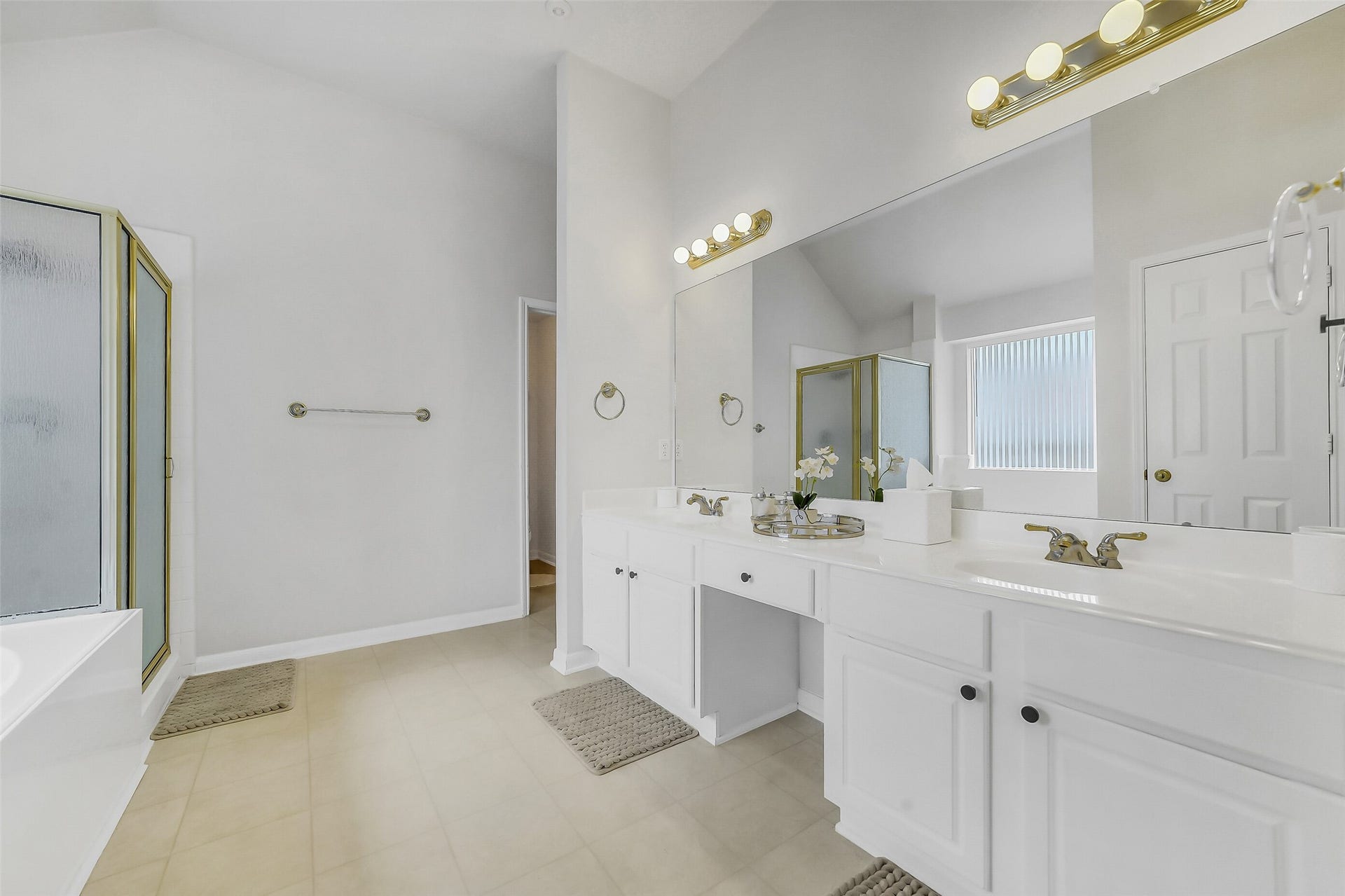 11219 Timbercreek Falls Drive, Houston, TX 77095 Primary bathroom with stylish his-and-her sink.