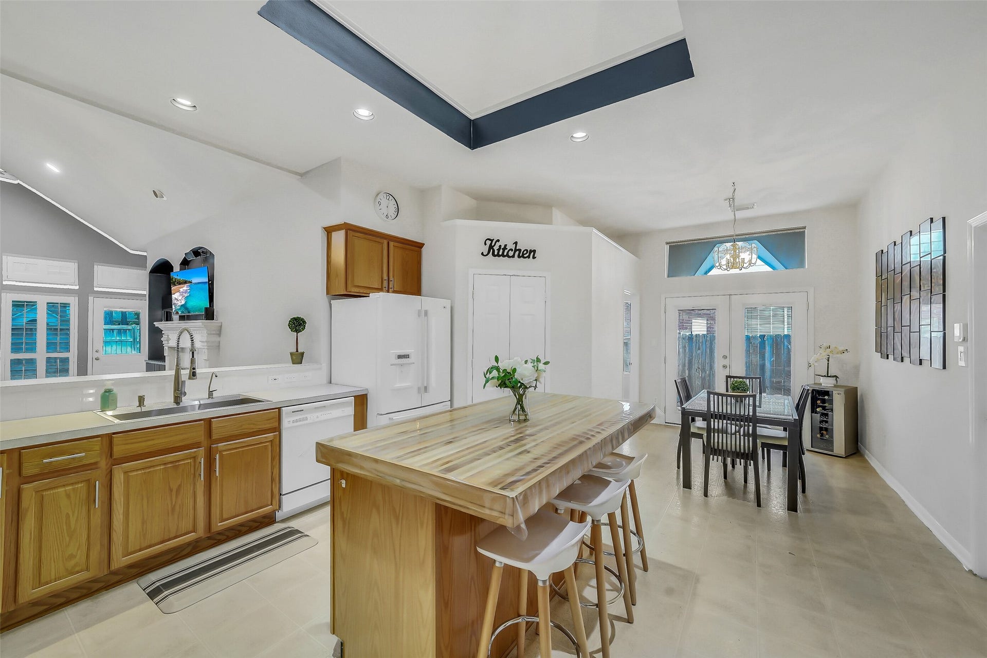 11219 Timbercreek Falls Drive, Houston, TX 77095 The spacious kitchen is bathed in natural light from a skylight, featuring a custom island and ample counter space for all your culinary adventures.