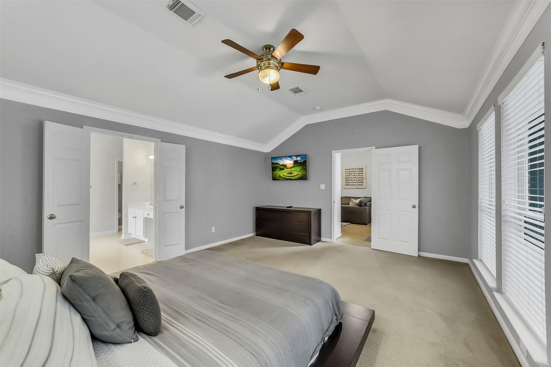11219 Timbercreek Falls Drive, Houston, TX 77095 Primary bedroom features tray ceiling, ceiling fan, and en-suite bathroom.