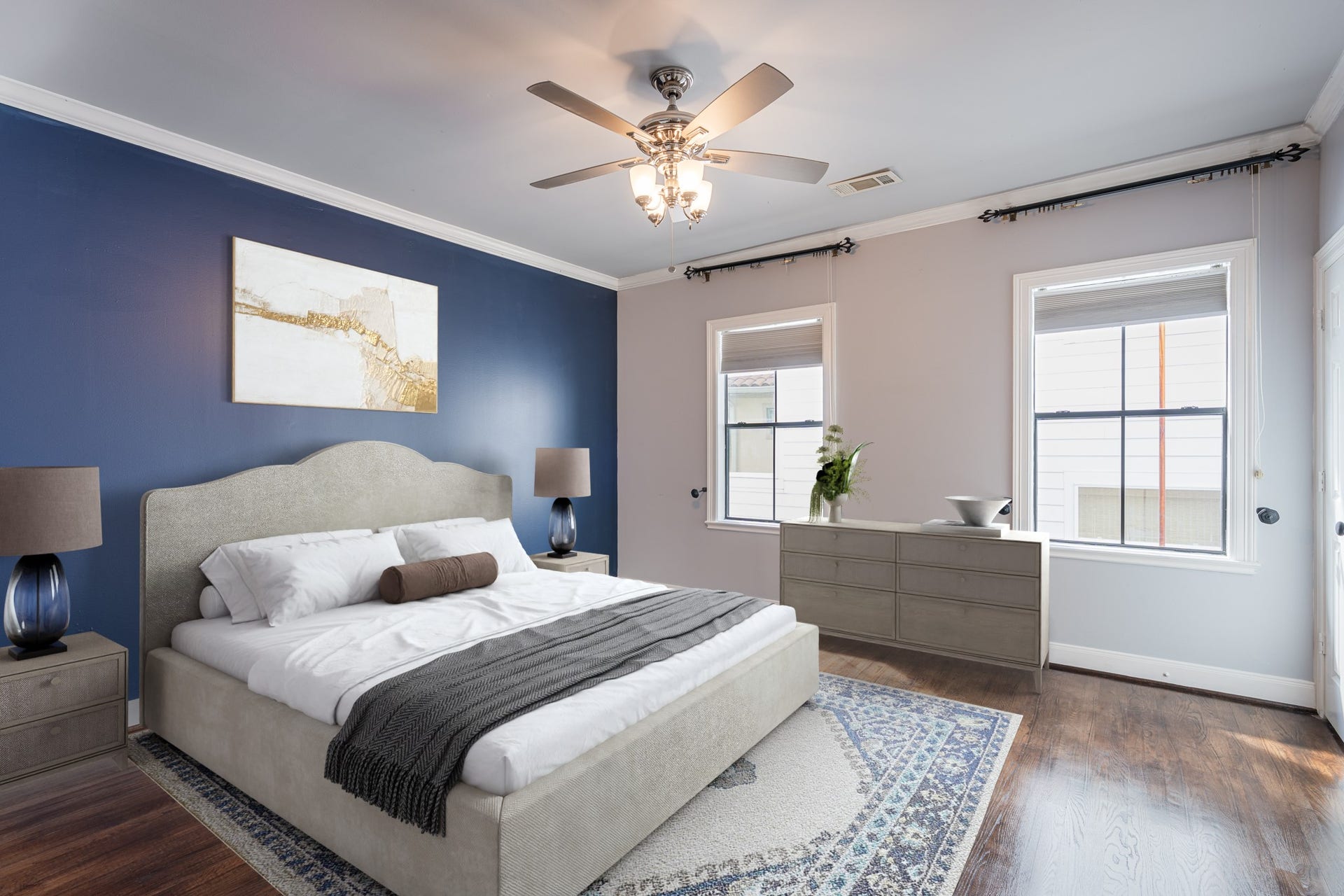 Secondary bedroom imagined as a guest room. It has an en-suite bath and a step-in closet. *Photo is virtually staged*