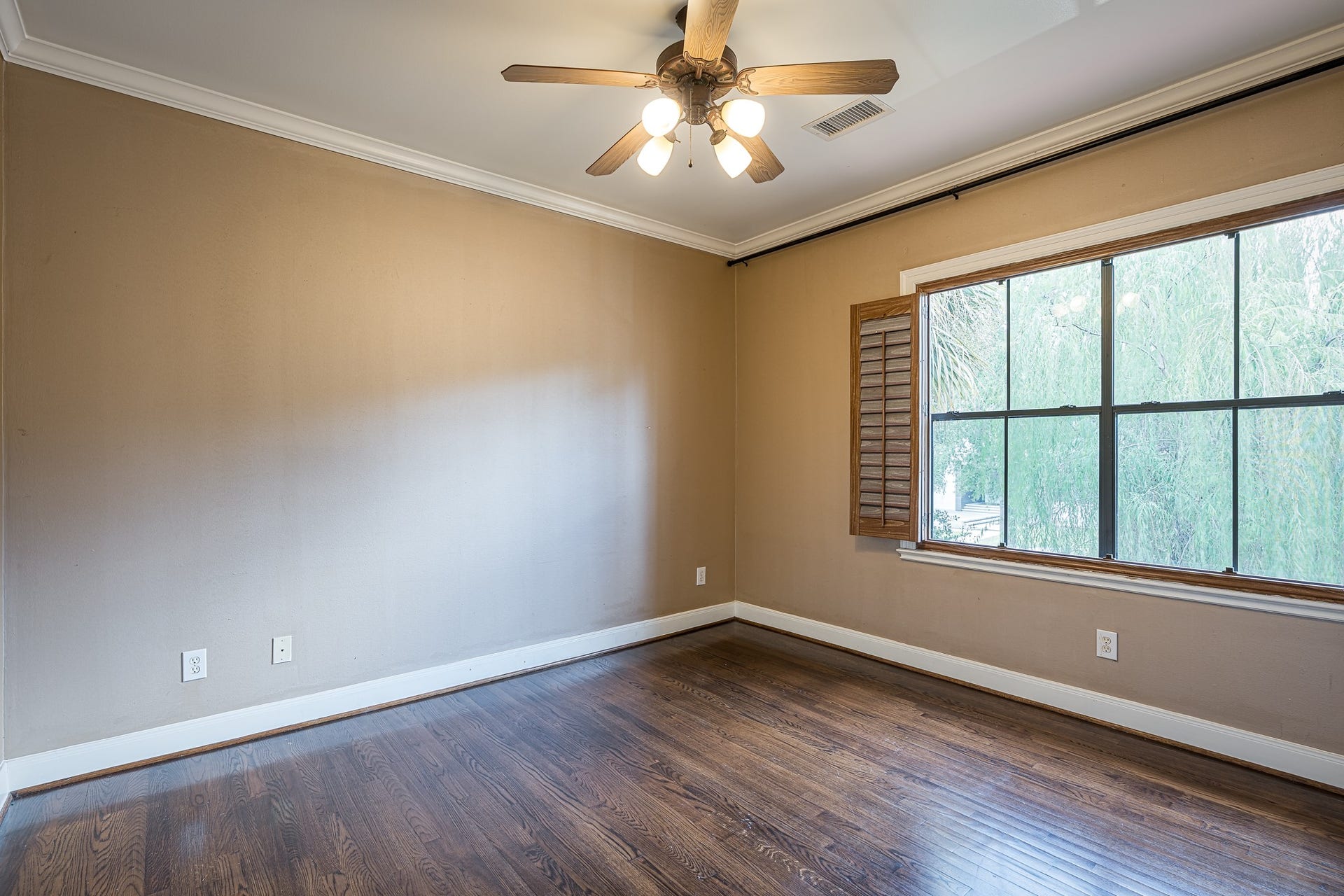 This secondary room on the front side of the home has an en-suite bath and a walk-in closet