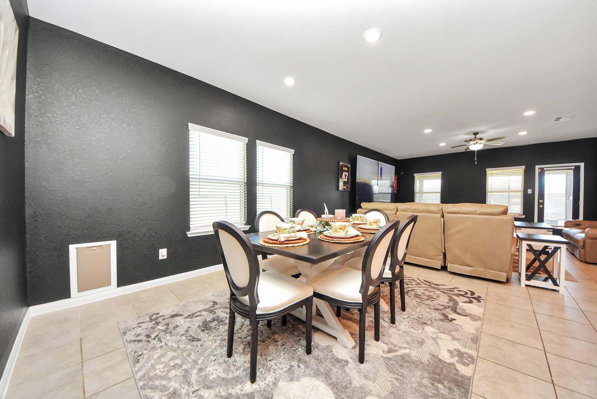 930 Pismo Lane, Rosharon, TX 77583 Note the doggie door in the corner which leads to a large side yard enclosure for your pup. Large windows allow natural light to brighten the room.