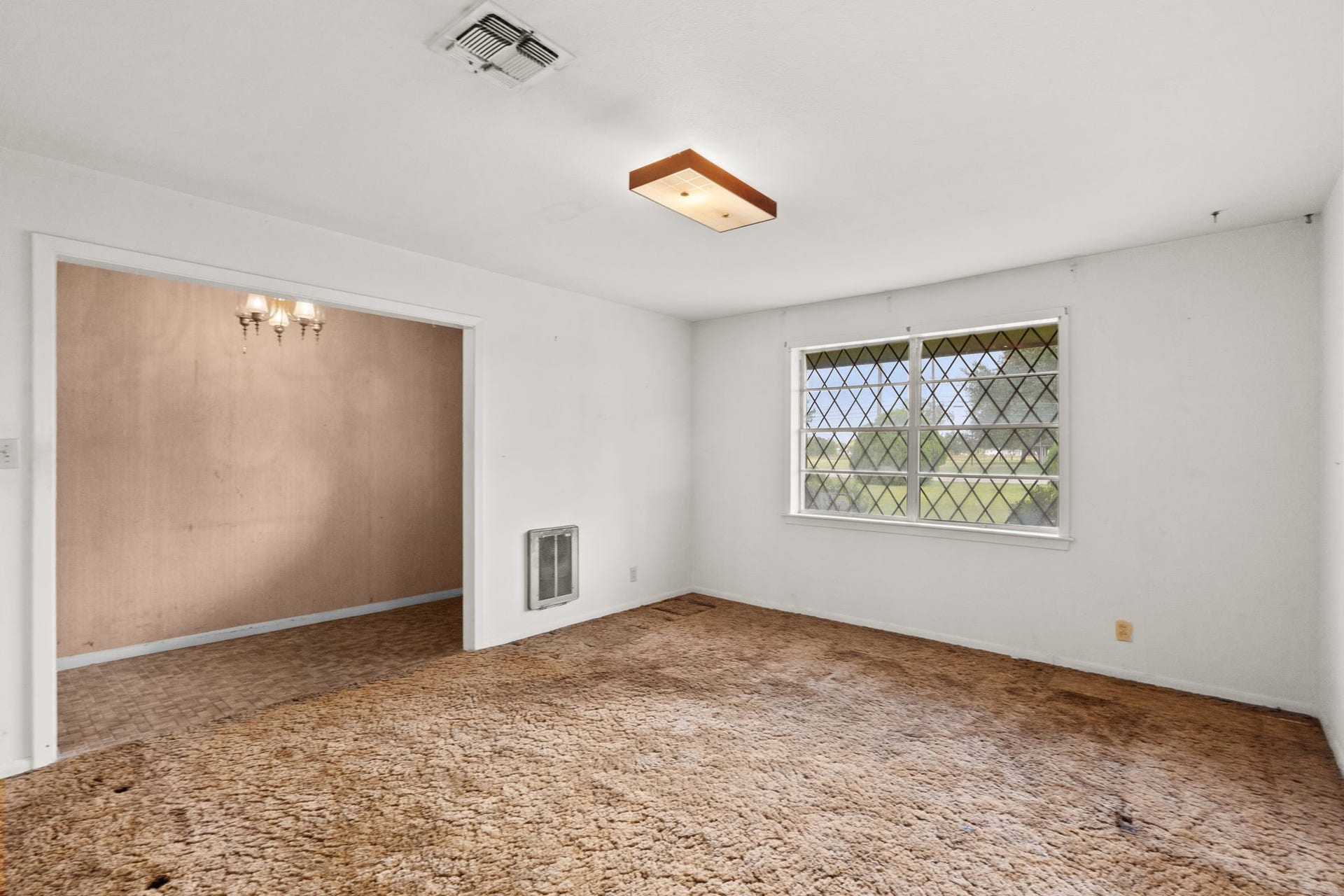 8218 Avenue M, Santa Fe, TX 77510 Additional view of the living room and adjoining dining area.