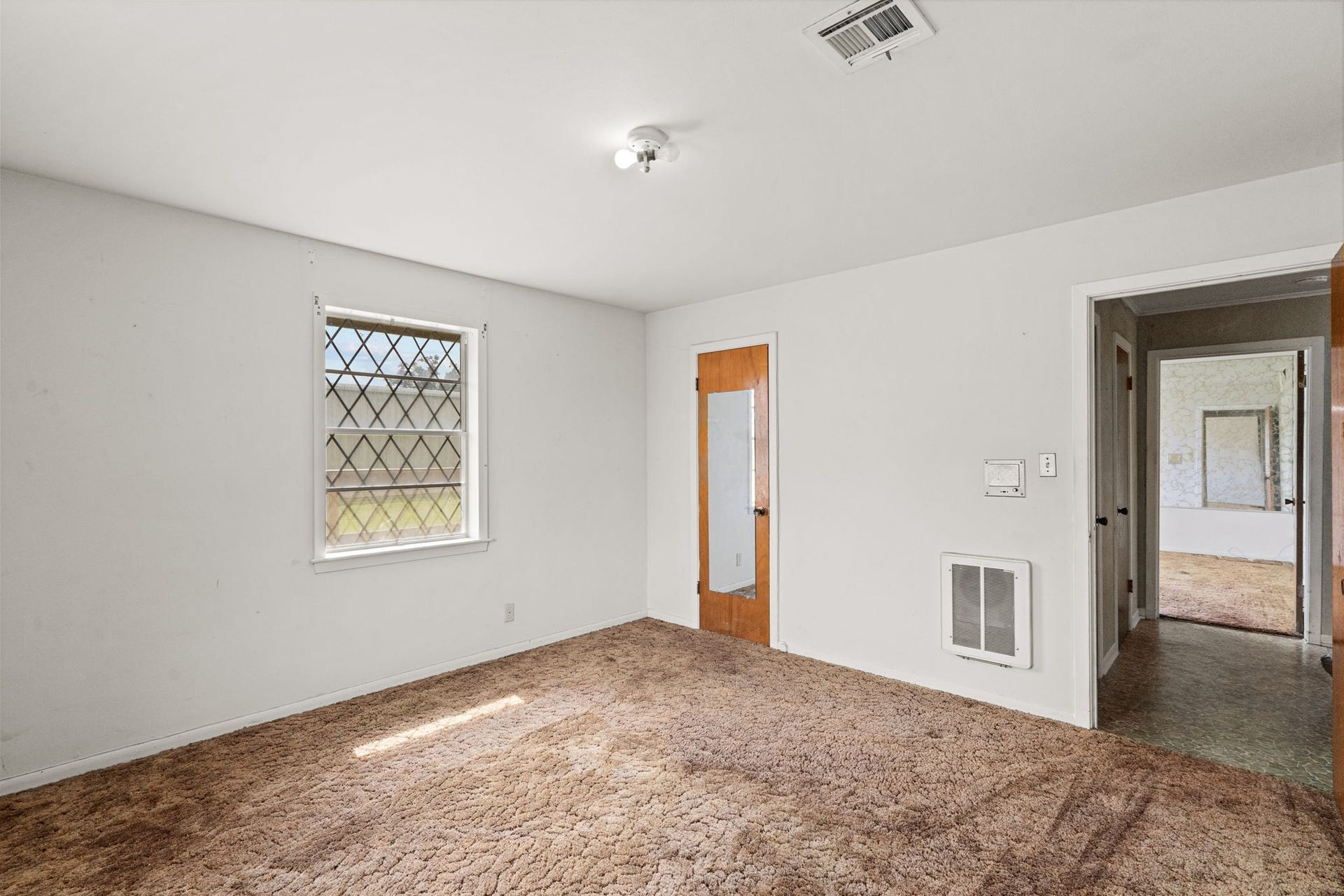 8218 Avenue M, Santa Fe, TX 77510 Additional bedroom view showing closet and hallway access.