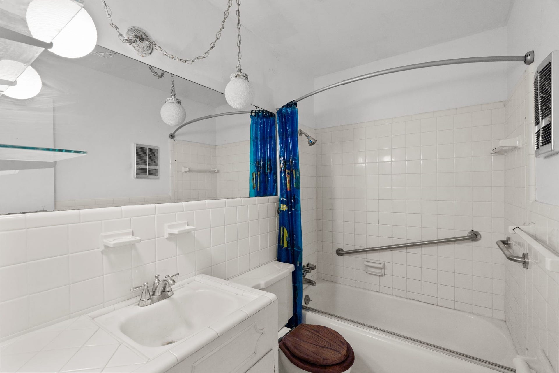 8218 Avenue M, Santa Fe, TX 77510 Full bathroom with tiled tub/shower combination and vanity.