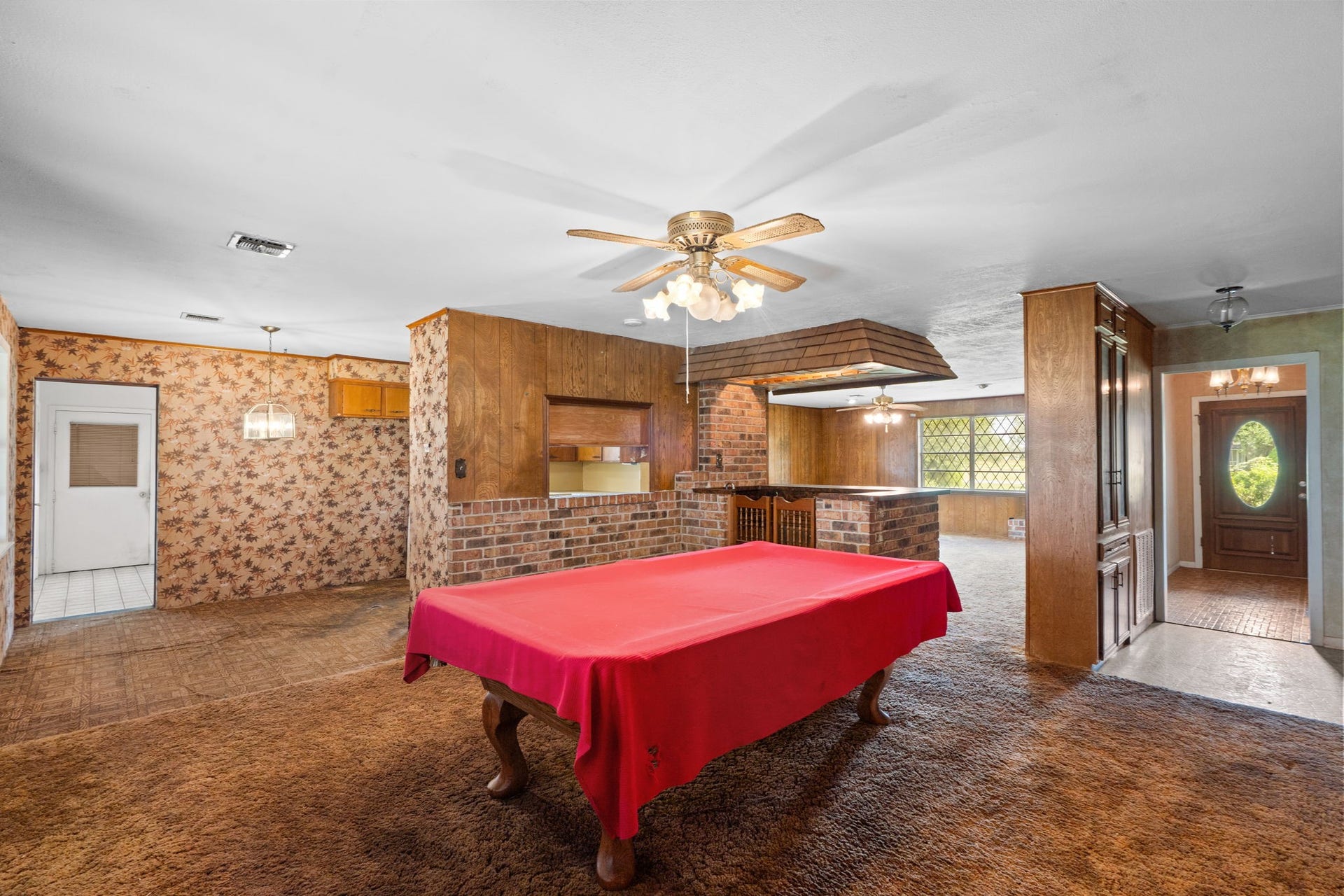 8218 Avenue M, Santa Fe, TX 77510 Open gathering area with brick accents.