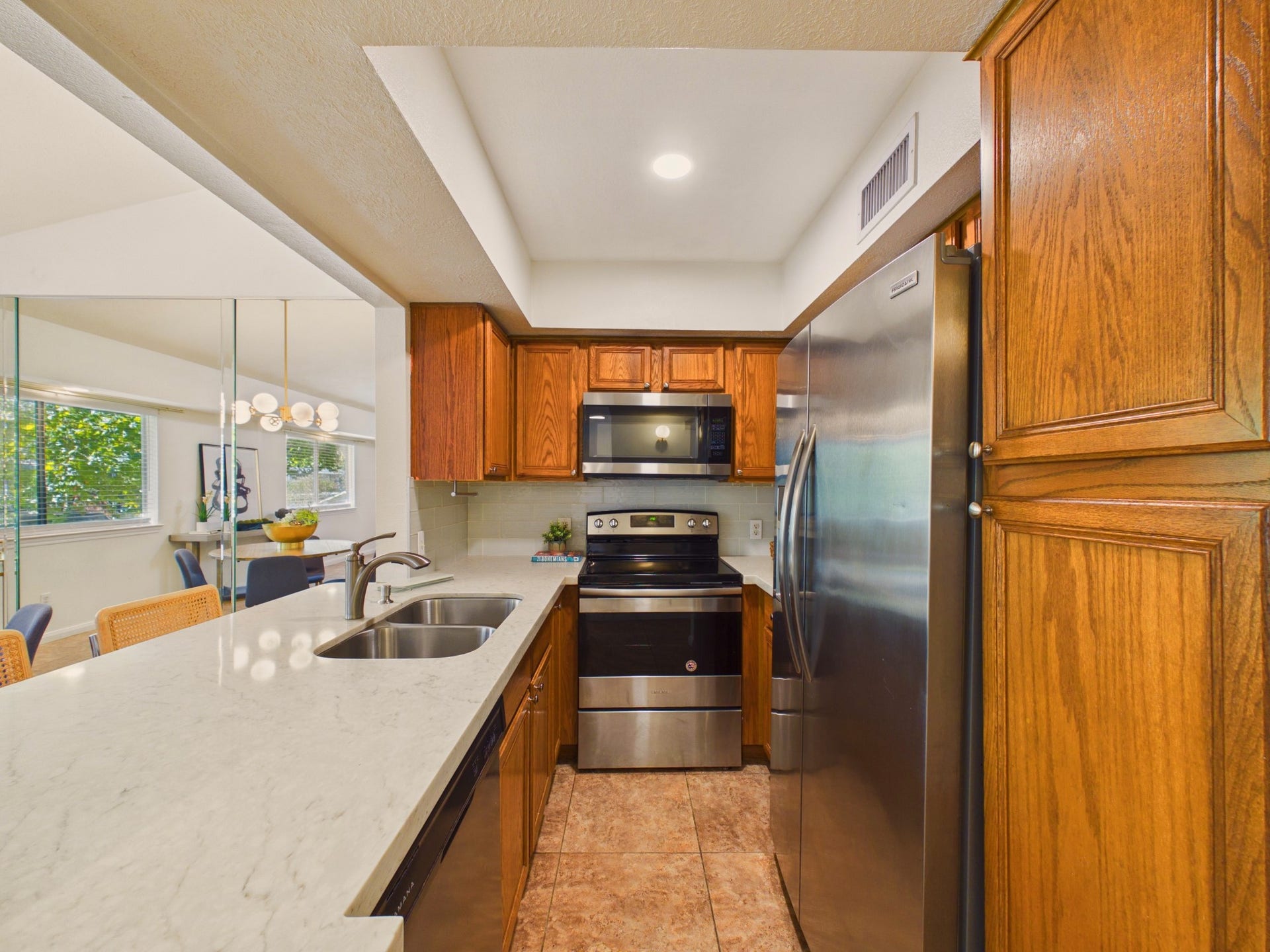 6404 Bayou Glen Road, Houston, TX 77057 Undermounted Double Sink and Stainless Steel French Door Refrigerator, Dishwasher, Range & Microwave