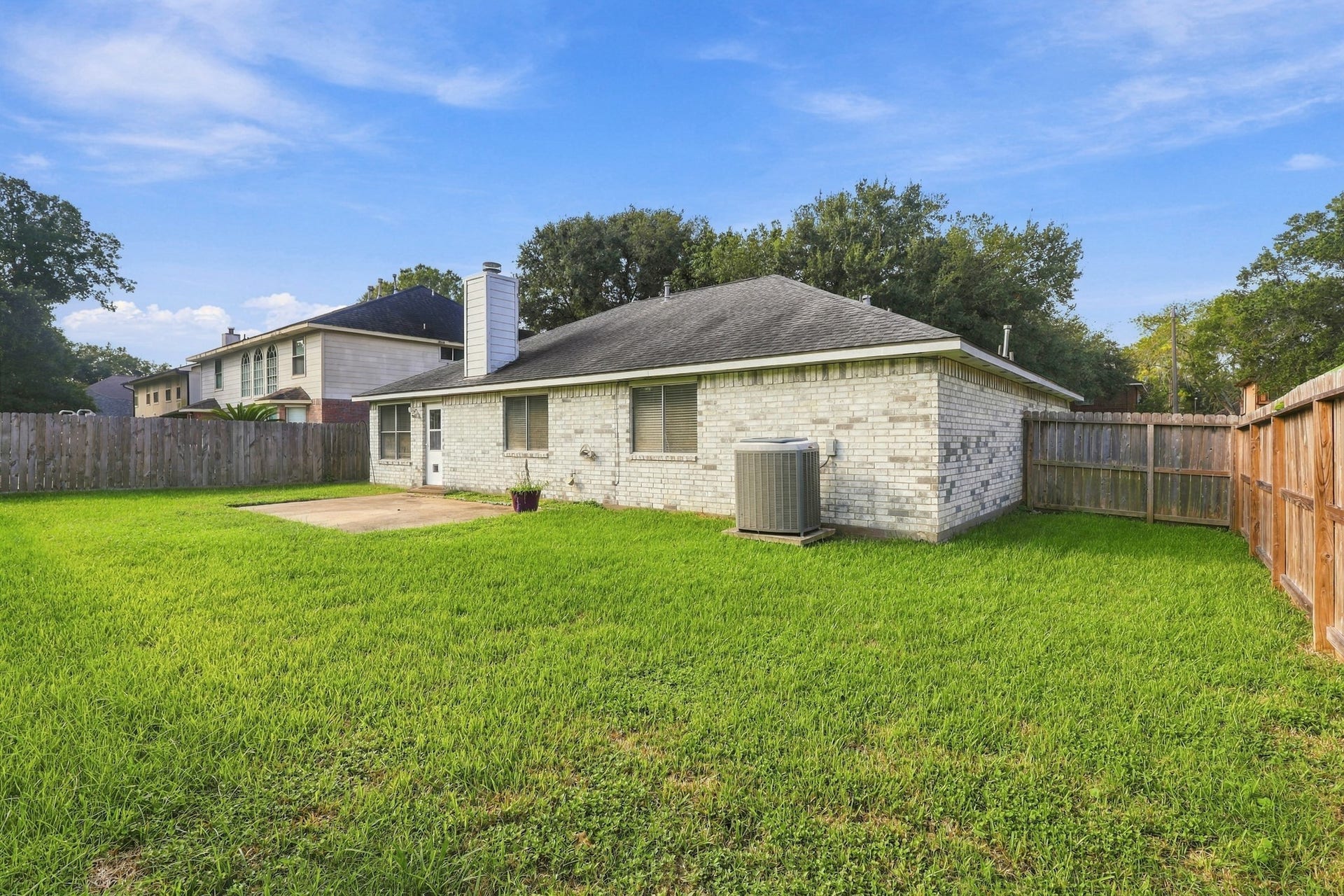 1242 Hunter Wood Drive, League City, TX 77573 Another view of the generous fenced yard with room to create your own outdoor retreat.