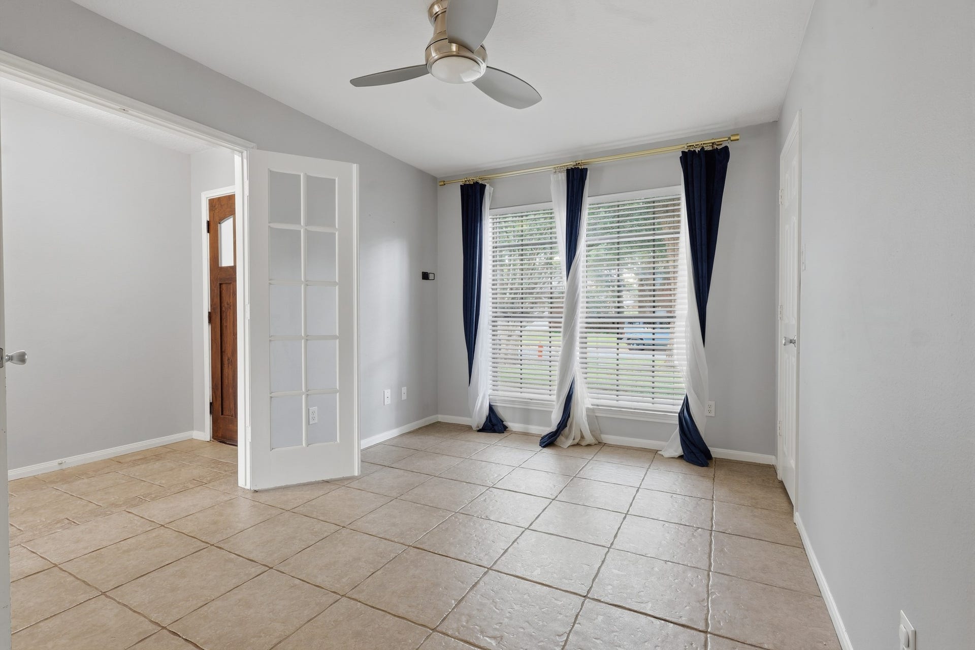 1242 Hunter Wood Drive, League City, TX 77573 French doors create a stylish entrance to this flexible bedroom or home office.