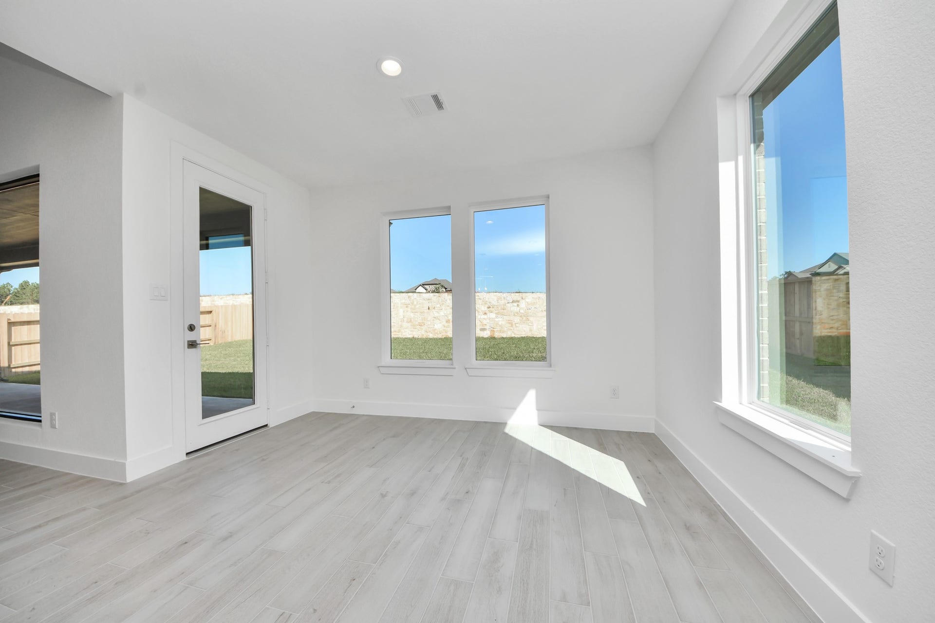 2052 Thimbleberry Lane, Magnolia, TX 77355 Enjoy breakfast with ease in the connected and cozy breakfast area, seamlessly integrated with the kitchen for utmost convenience. Step through the back door for a breath of fresh air onto the covered patio, extending your living space to the outdoors