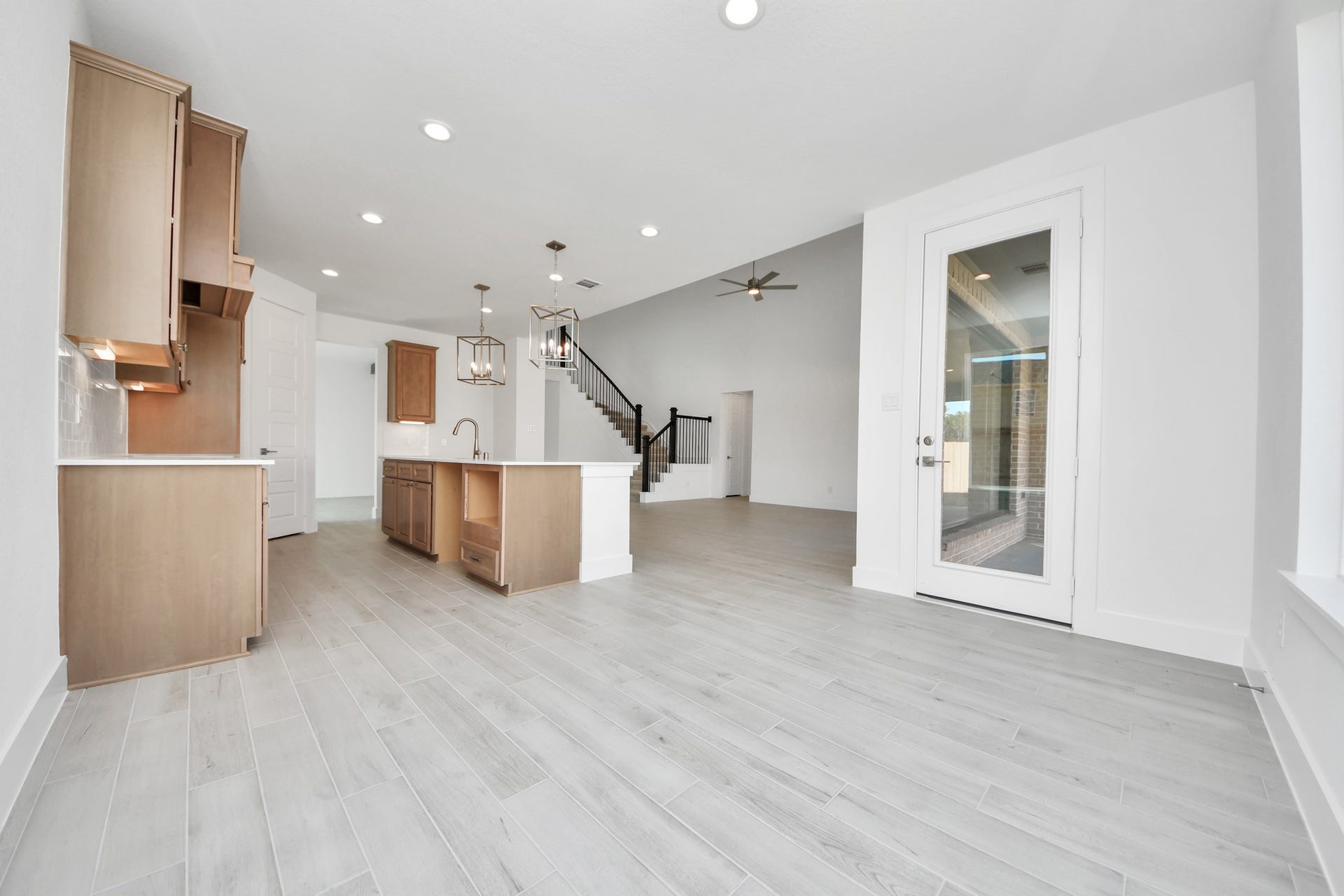2052 Thimbleberry Lane, Magnolia, TX 77355 Enjoy breakfast with ease in the connected and cozy breakfast area, seamlessly integrated with the kitchen for utmost convenience. Step through the back door for a breath of fresh air onto the covered patio, extending your living space to the outdoors