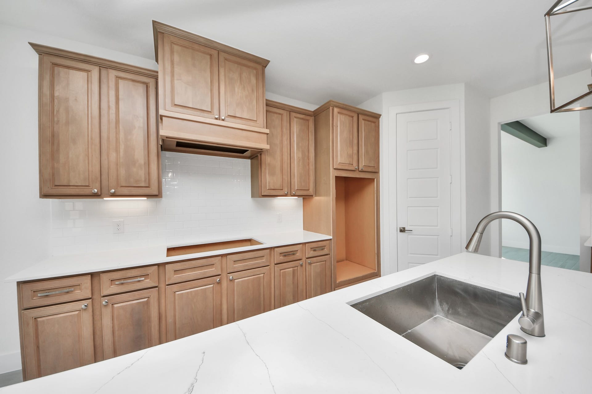 2052 Thimbleberry Lane, Magnolia, TX 77355 The open concept effortlessly connects the kitchen to the expansive family room, forming a perfect hub for gatherings. This seamless flow creates an inviting space where cooking and socializing come together harmoniously.