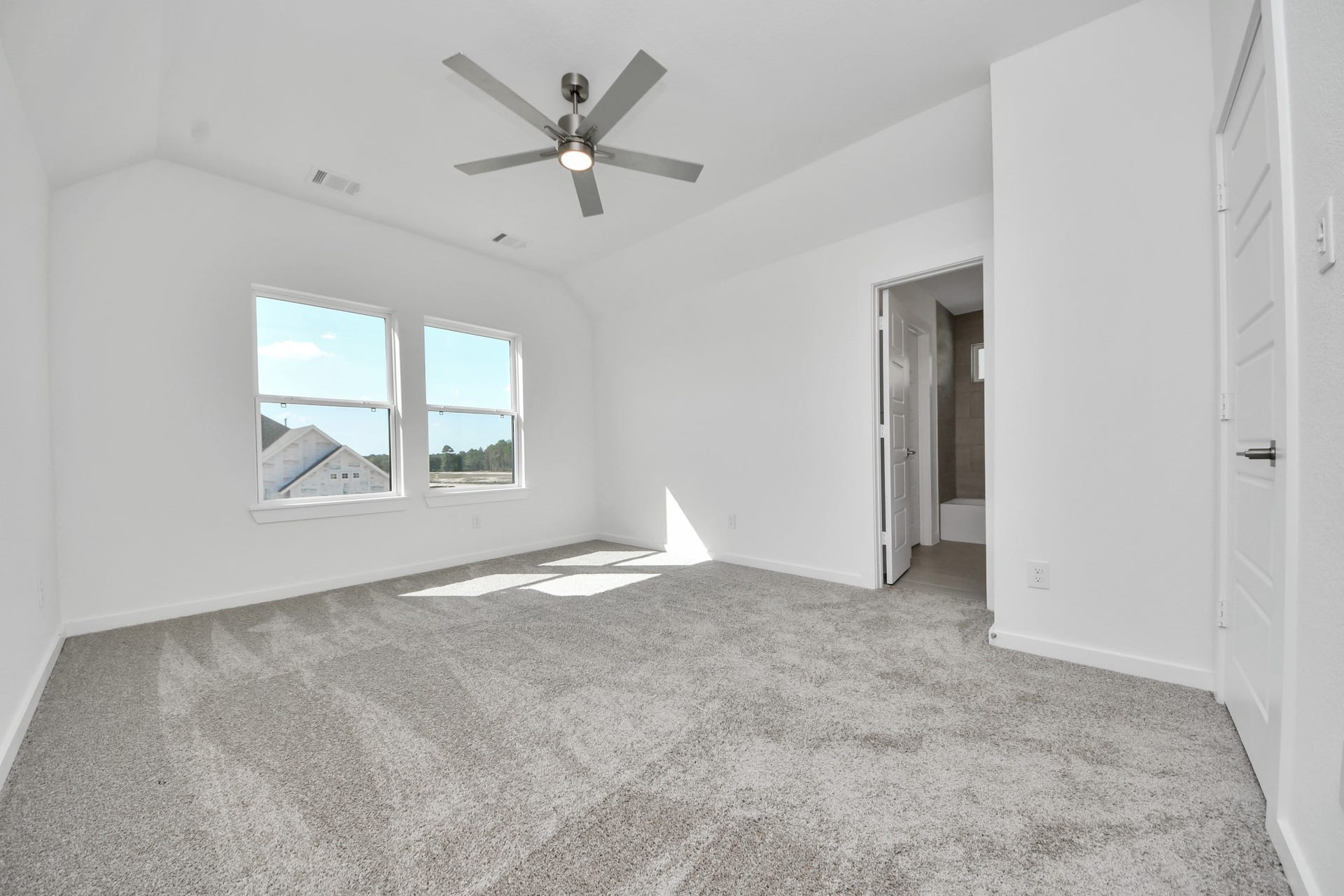 2052 Thimbleberry Lane, Magnolia, TX 77355 Generously sized secondary bedrooms featuring spacious closets, soft and inviting carpeting underfoot, large windows allowing plenty of natural light, and the added touch of privacy blinds for your personal retreat.