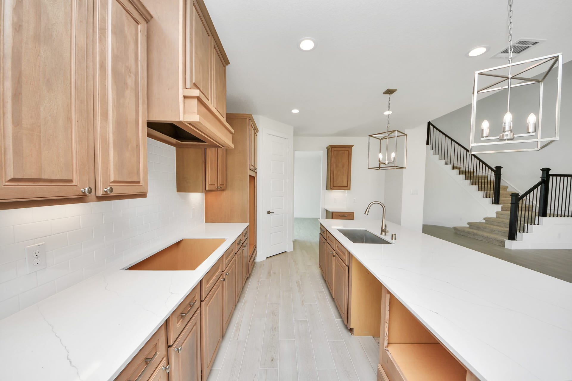 2052 Thimbleberry Lane, Magnolia, TX 77355 The extended counter area adds both practicality and style, making meal preparation a breeze. Every detail is thoughtfully designed to enhance the kitchen's functionality and aesthetic appeal.