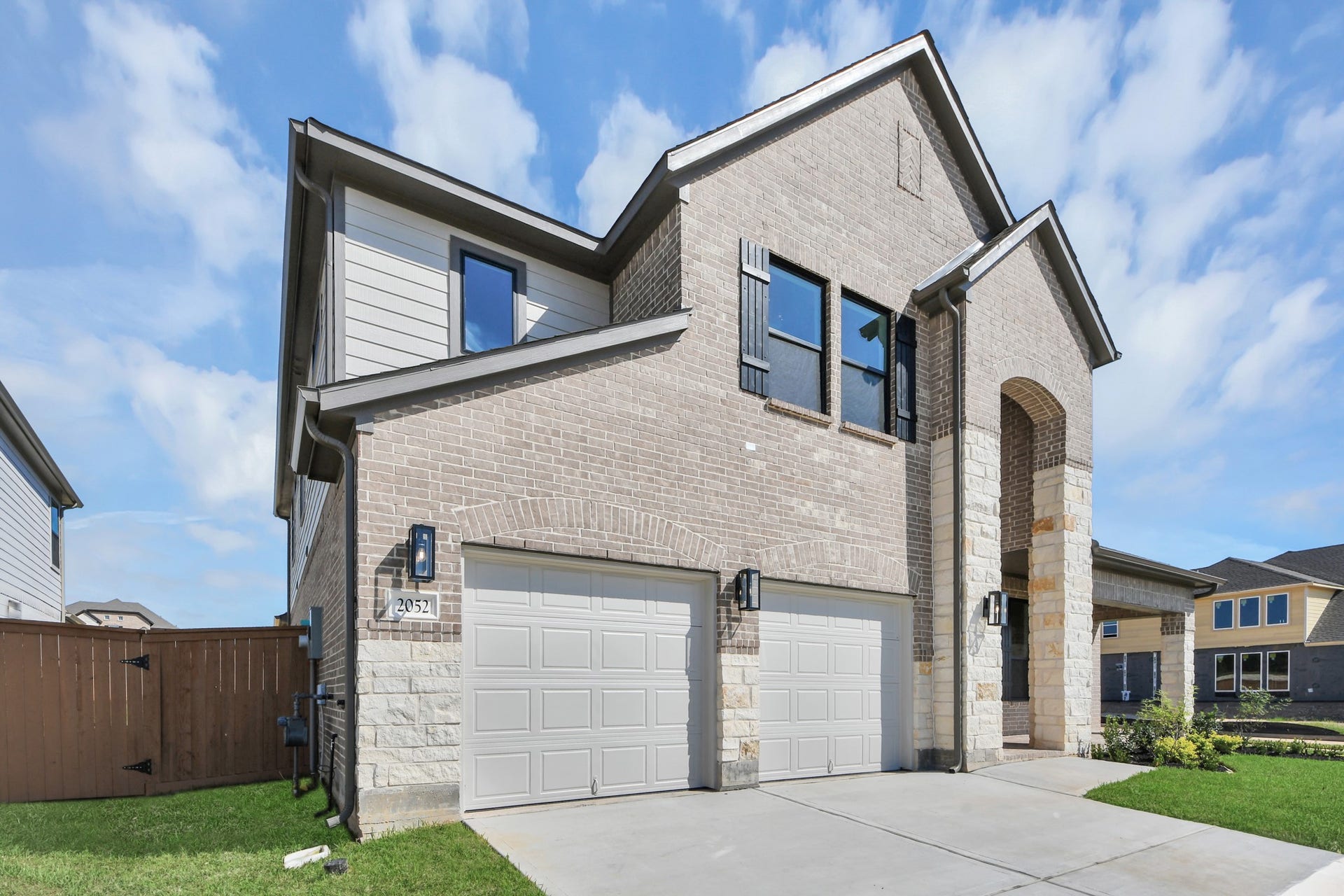 2052 Thimbleberry Lane, Magnolia, TX 77355 Home features a convenient 2-car garage complemented by a spacious driveway, offering ample parking for you and your guests.