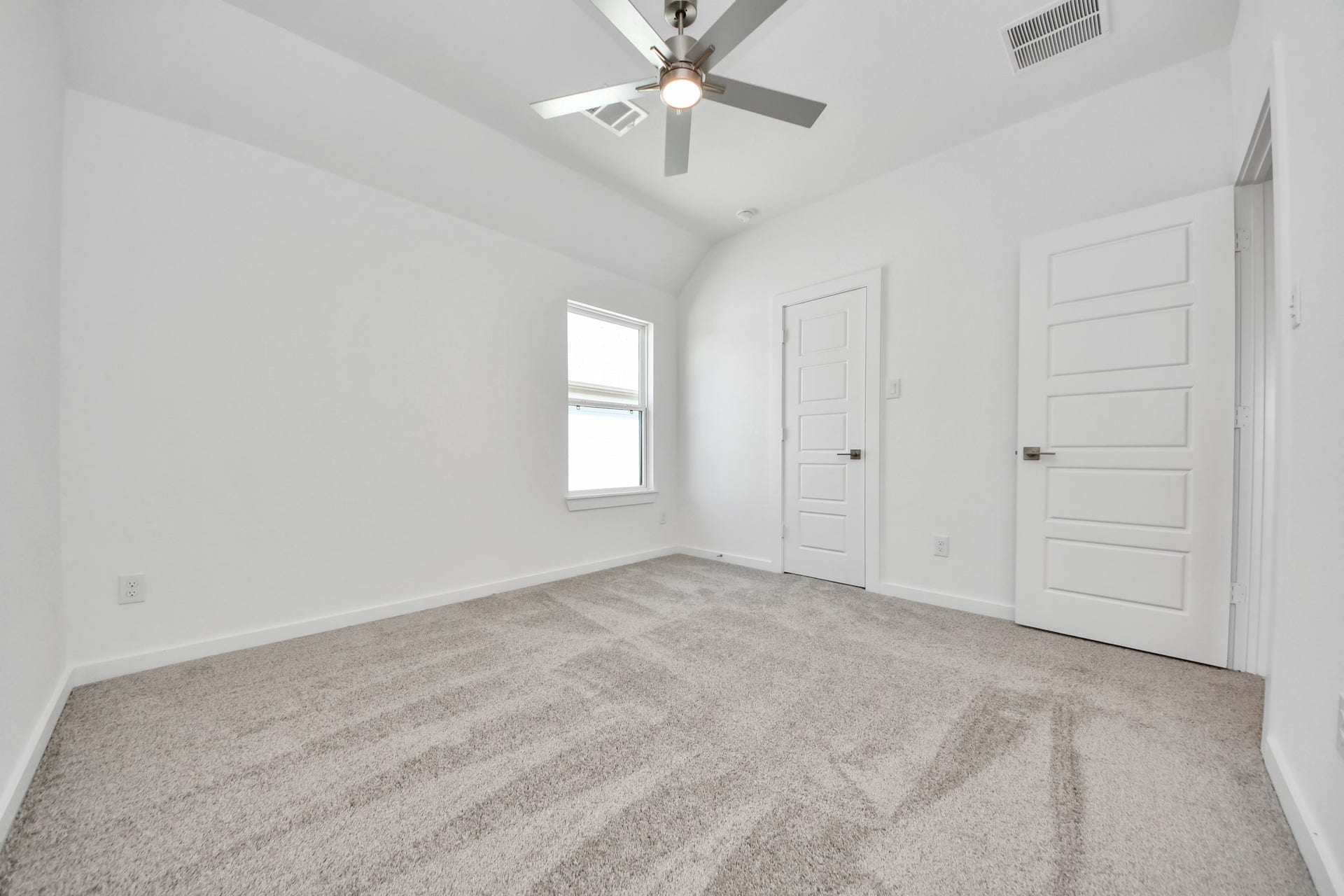 2052 Thimbleberry Lane, Magnolia, TX 77355 Generously sized secondary bedrooms featuring spacious closets, soft and inviting carpeting underfoot, large windows allowing plenty of natural light, and the added touch of privacy blinds for your personal retreat.