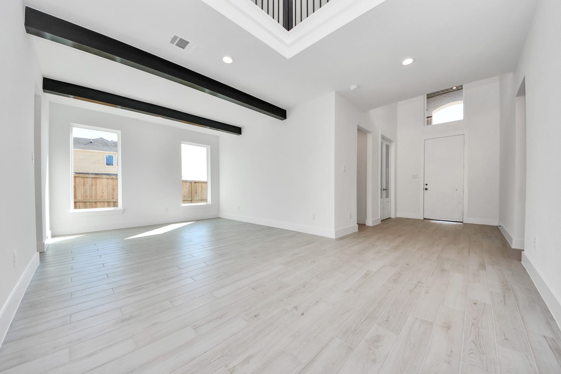 2052 Thimbleberry Lane, Magnolia, TX 77355 Create lasting memories with your family and friends at the dining table! This expansive dining room showcases sophisticated flooring, custom paint, and seamlessly connects to the family room and kitchen, providing an open and inviting atmosphere