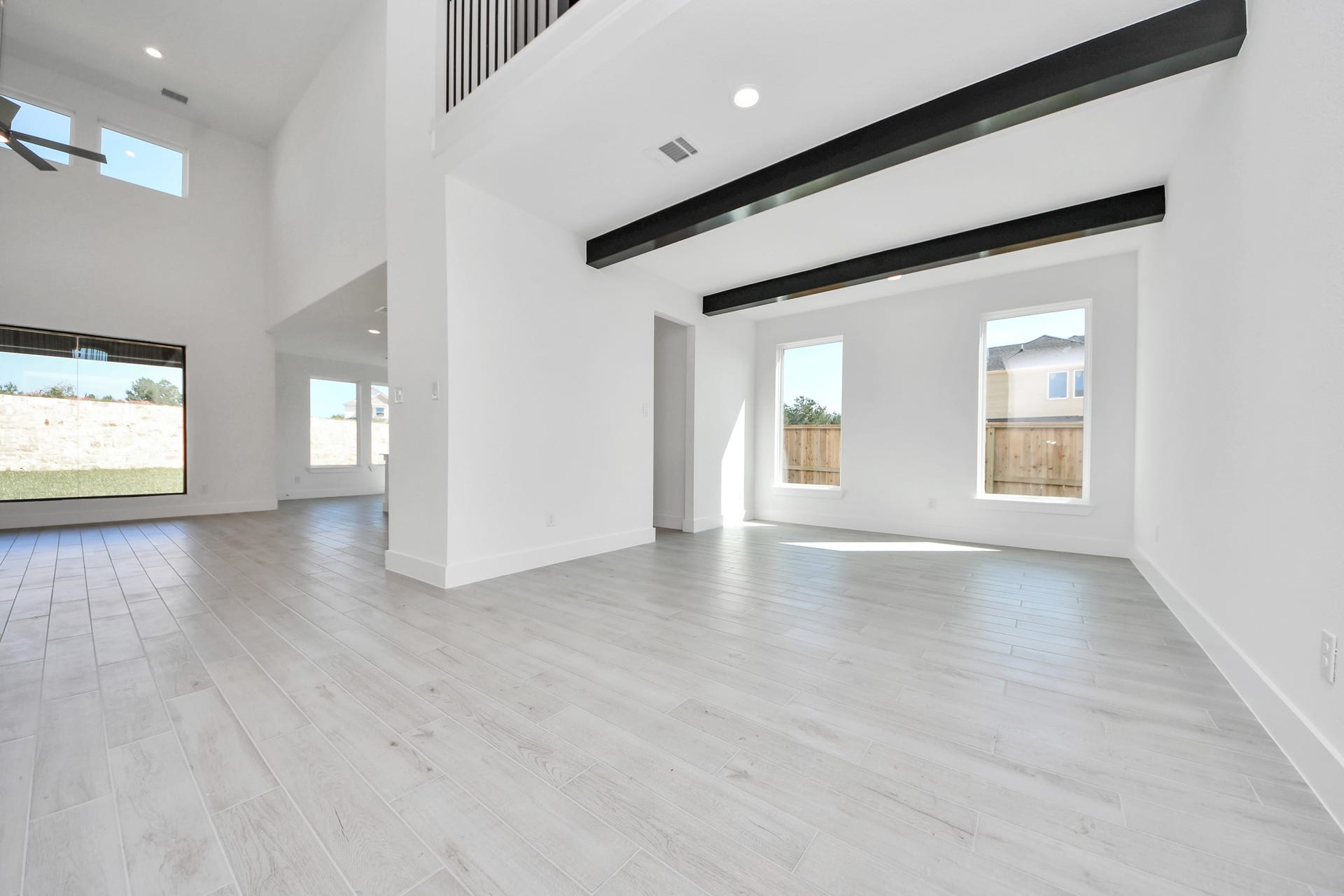 2052 Thimbleberry Lane, Magnolia, TX 77355 Make memories gathered around the table with your family and friends! This spacious dining room features elegant flooring, custom paint, and adjacent to family room and kitchen for open concept feel.