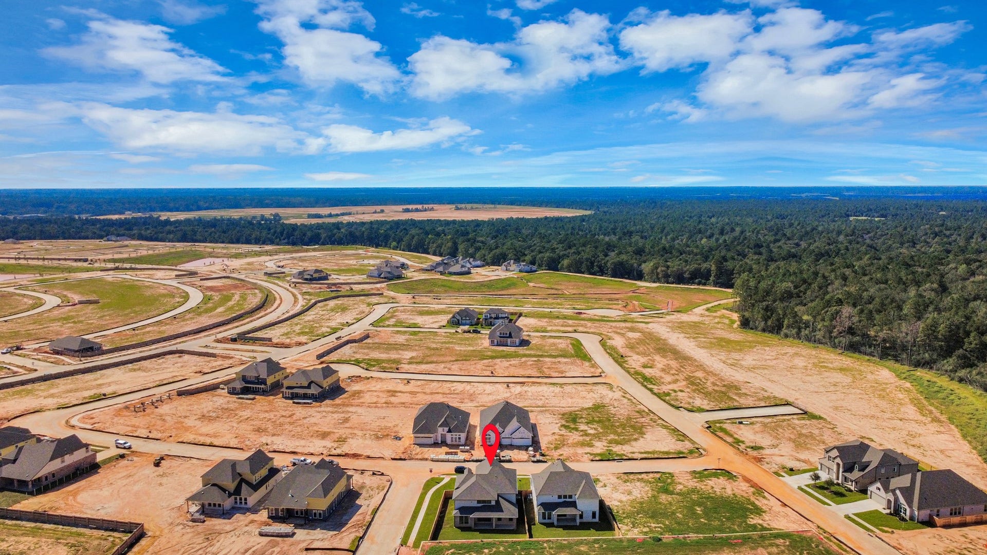 2052 Thimbleberry Lane, Magnolia, TX 77355 An aerial view of a spacious subdivision lot, highlighting a well-maintained yard and a fully fenced perimeter, offering both privacy and expansive outdoor space.