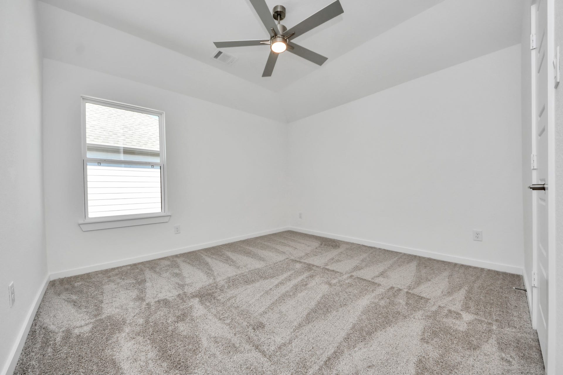 2052 Thimbleberry Lane, Magnolia, TX 77355 Generously sized secondary bedrooms featuring spacious closets, soft and inviting carpeting underfoot, large windows allowing plenty of natural light, and the added touch of privacy blinds for your personal retreat.