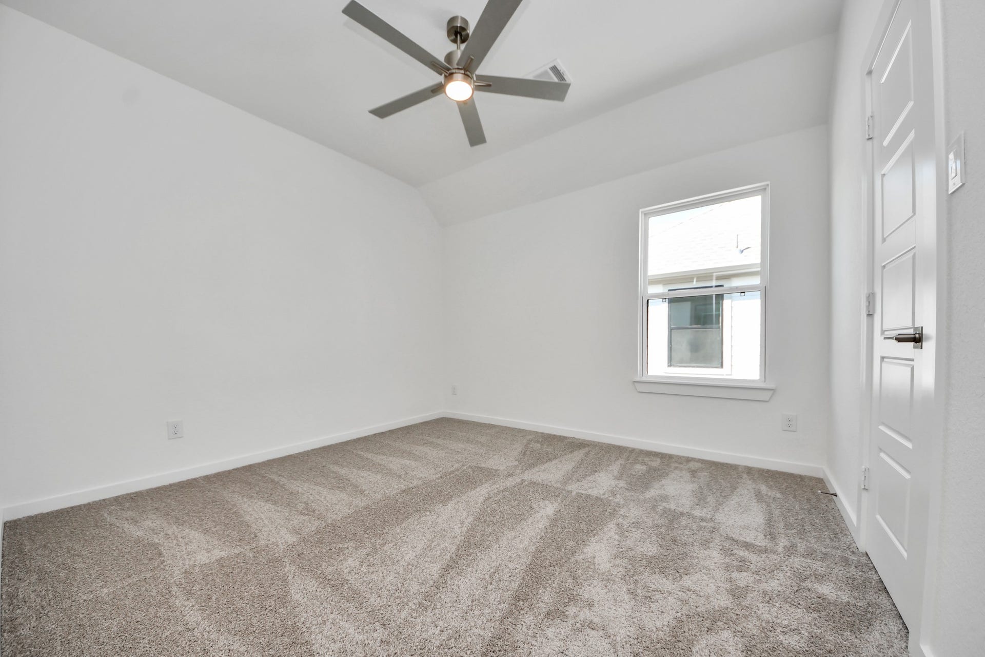 2052 Thimbleberry Lane, Magnolia, TX 77355 Secondary bedroom features plush carpeting, large windows that let in plenty of natural light, bright paint, and spacious closets.