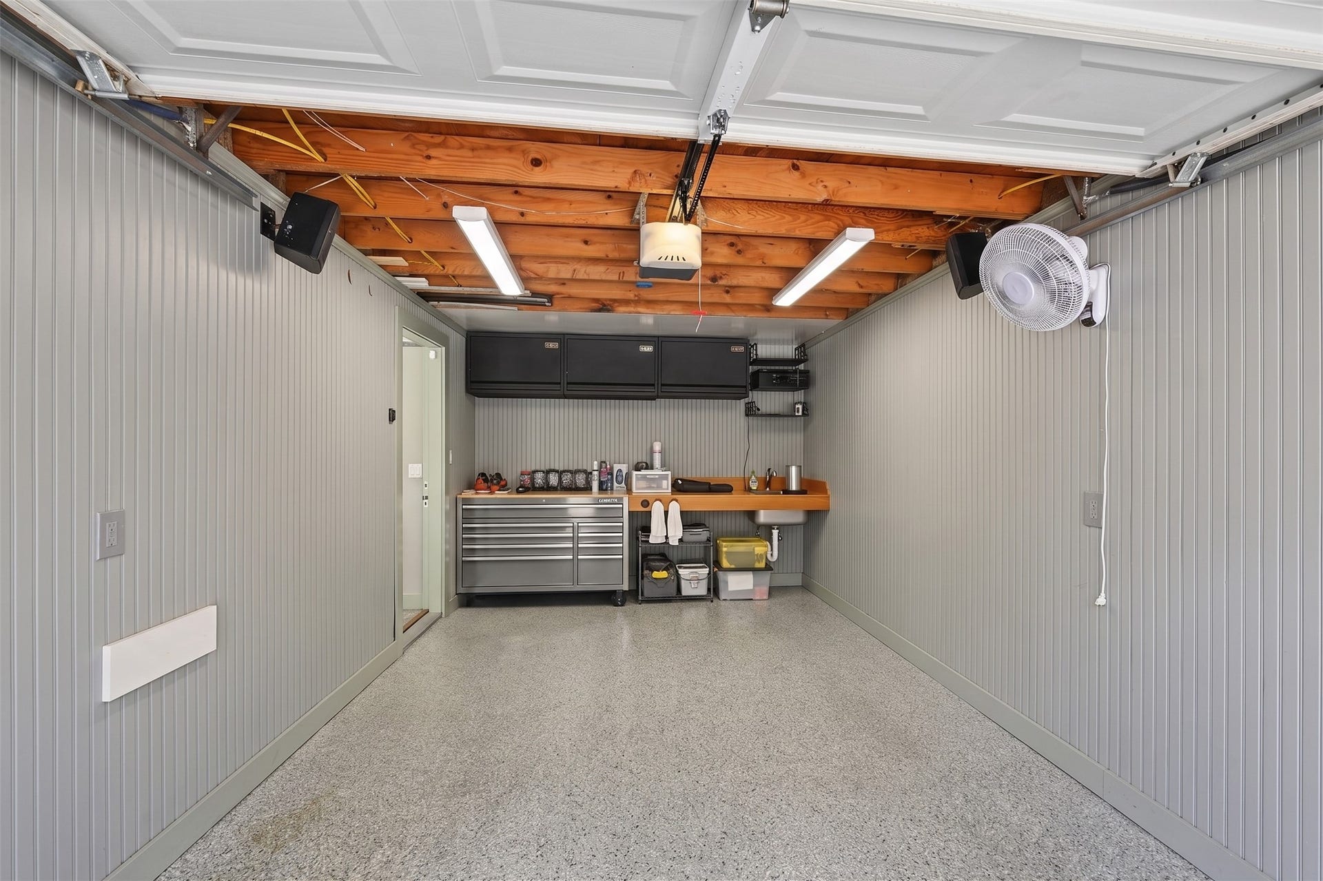 5879 Valley Forge Drive, #107, Houston, TX 77057 The garage has beadboard walls, updated lighting, and epoxy floors!
