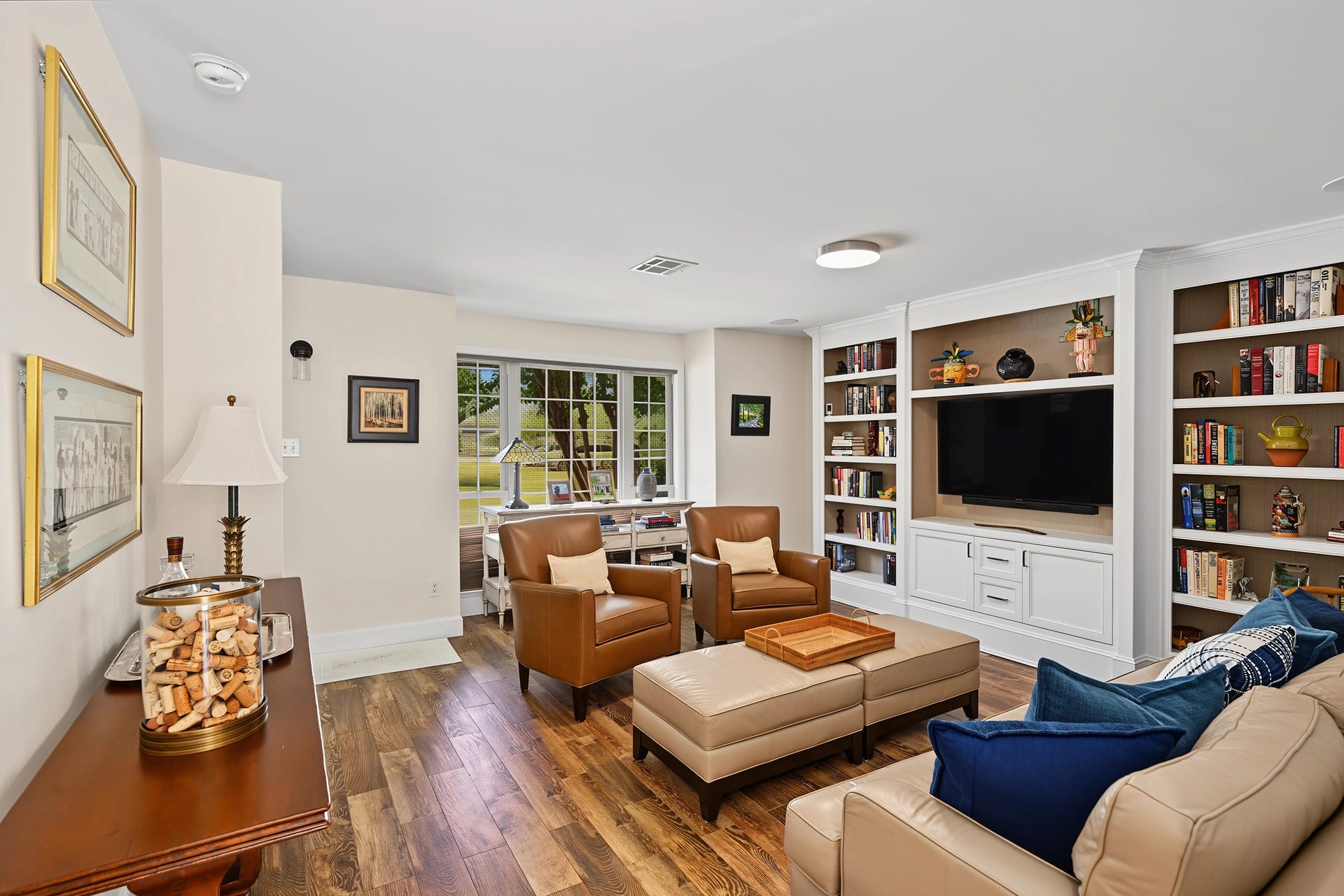 5879 Valley Forge Drive, #107, Houston, TX 77057 Step inside to a beautiful living room anchored by custom built-ins. TV included!