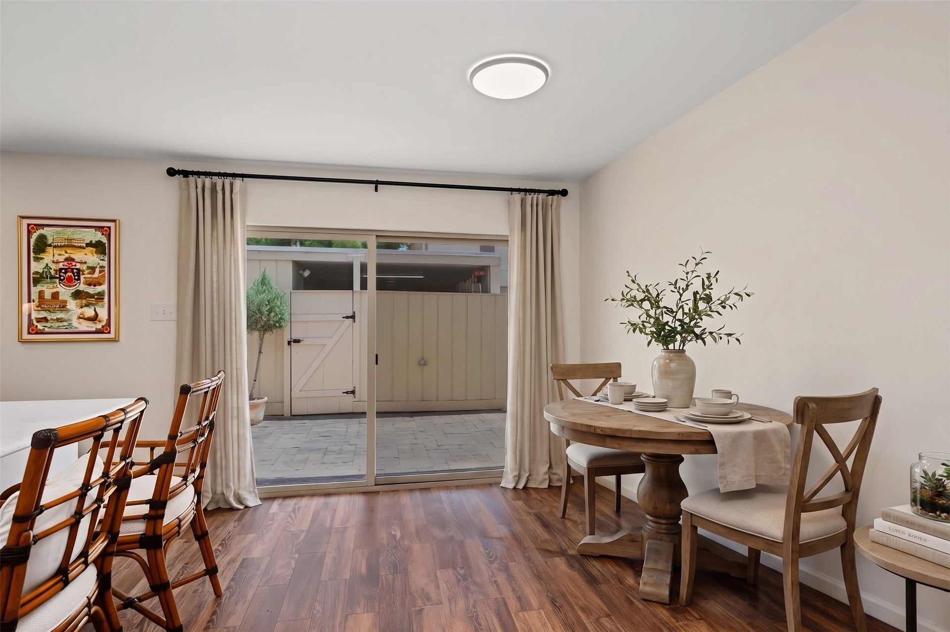 5879 Valley Forge Drive, #107, Houston, TX 77057 The dining area is generously sized and provides views to the back patio. This photo is virtually furnished.