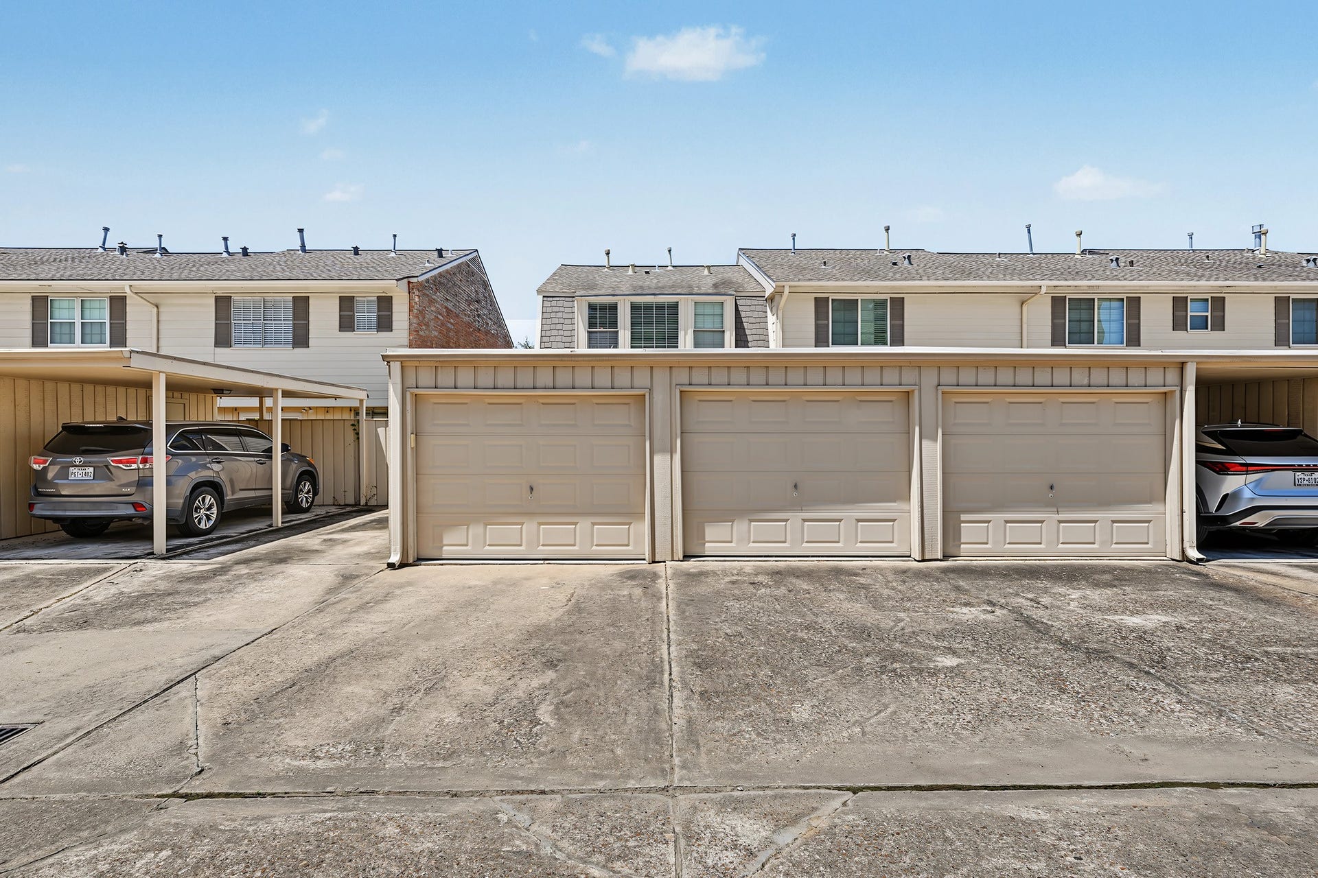5879 Valley Forge Drive, #107, Houston, TX 77057 This unit includes a carport (door 1 and is almost fully enclosed) and a garage (door 2).