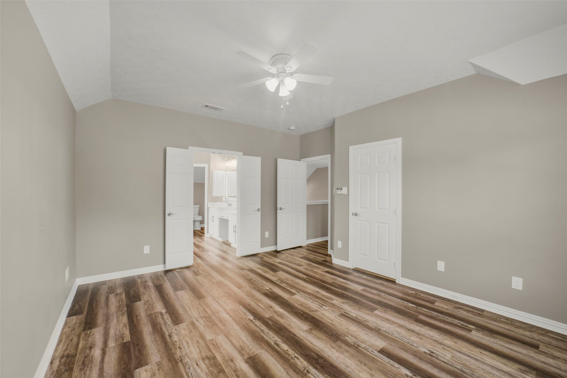 13023 Norstrum Falls Court, Cypress, TX 77429 An alternate view of the primary suite underscores the generous layout and features one of two closets, providing exceptional storage space right off the bedroom area.