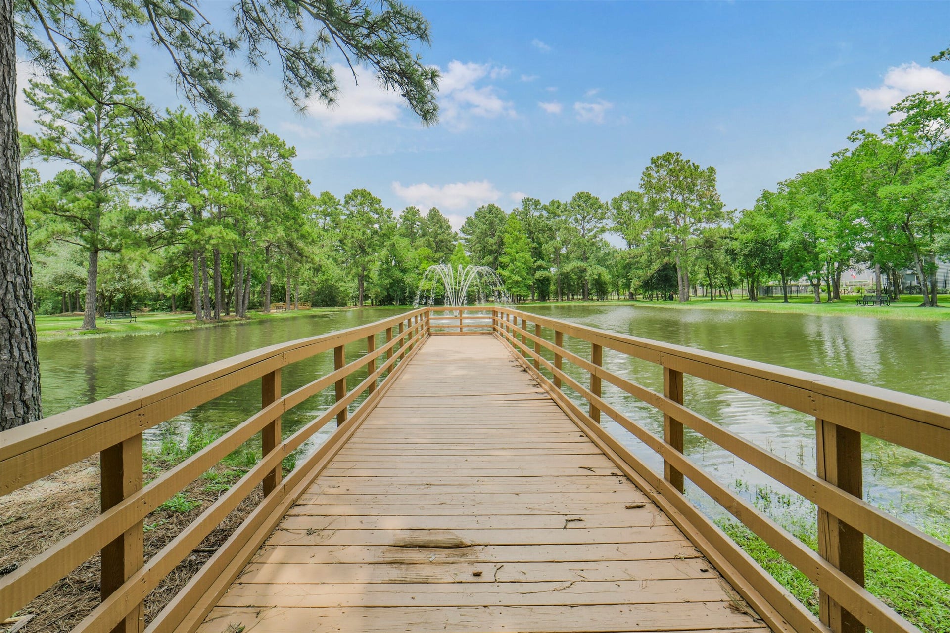 13023 Norstrum Falls Court, Cypress, TX 77429 Enjoy peaceful afternoons by the water with direct access to a neighborhood dock, a scenic fishing pond, and a beautiful fountain feature.