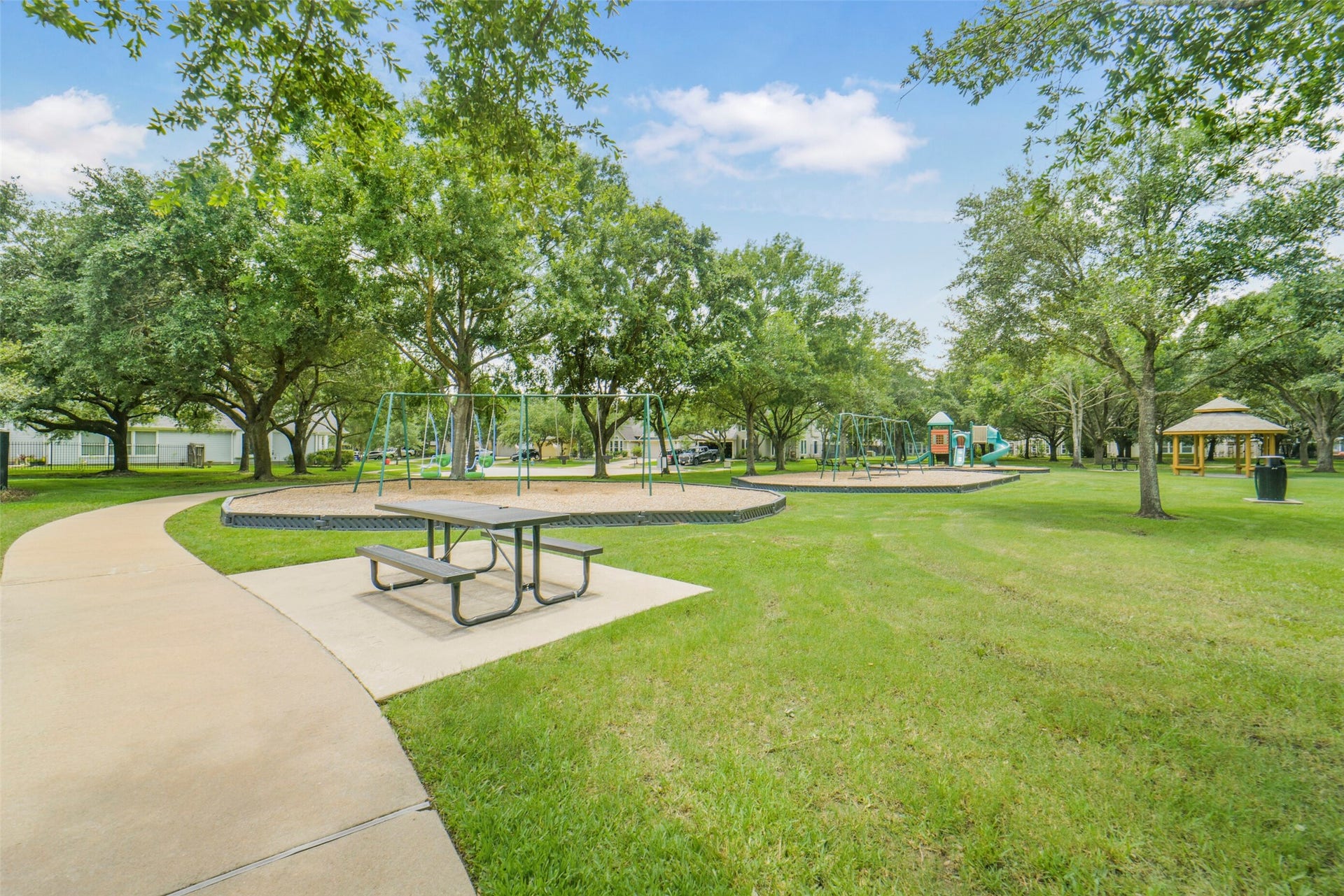 13023 Norstrum Falls Court, Cypress, TX 77429 A fantastic neighborhood playground offers a great outdoor space for recreation and play.