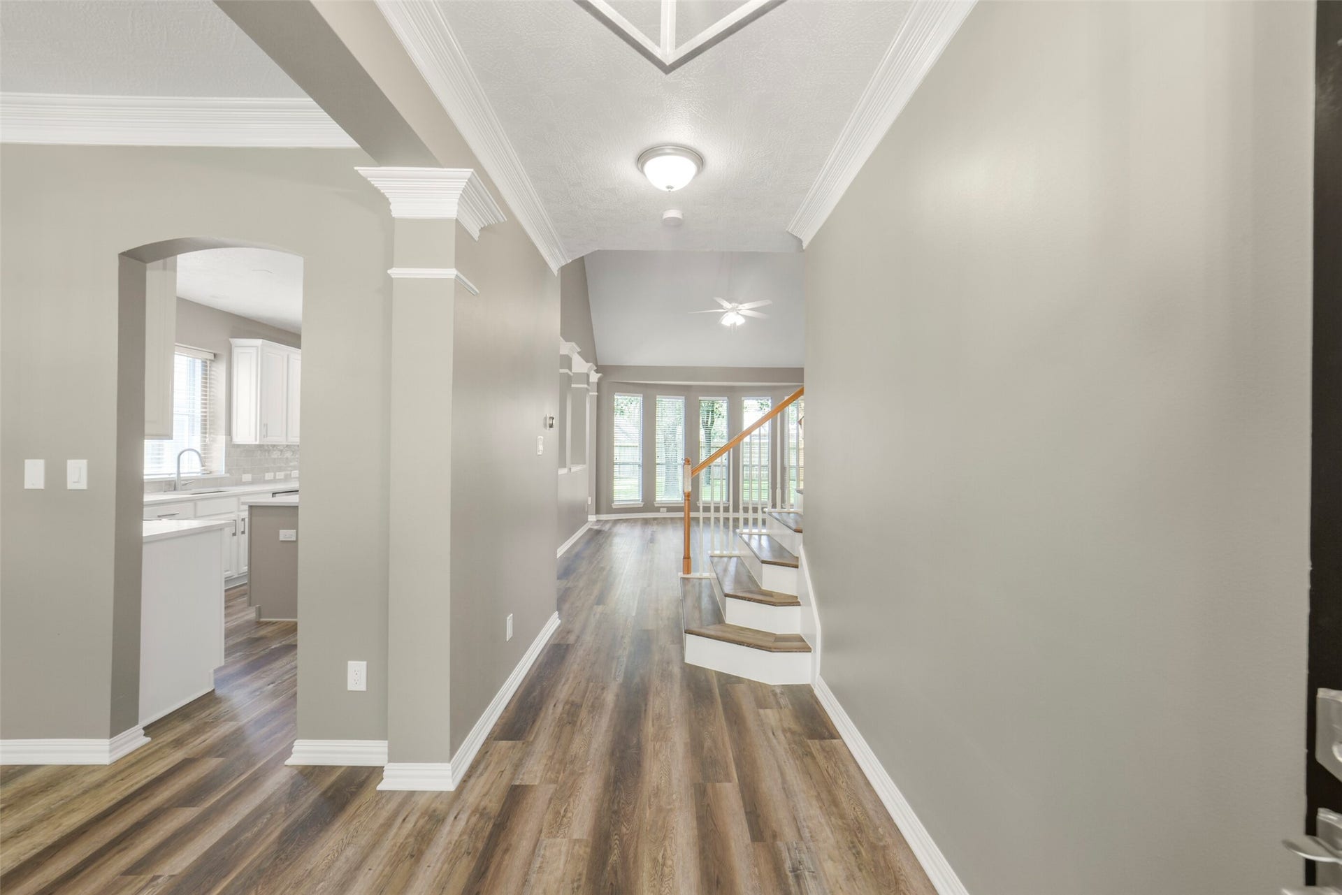 13023 Norstrum Falls Court, Cypress, TX 77429 A grand and inviting entry features elegant wood floors that set a sophisticated tone the moment you step inside.