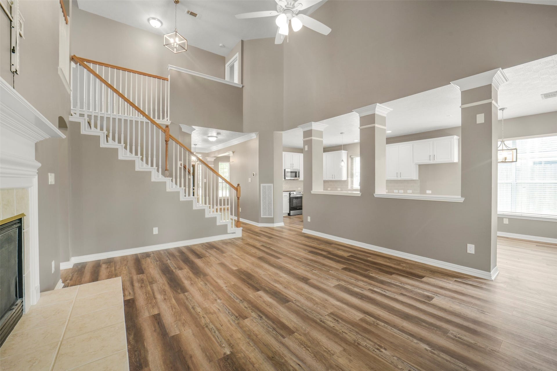 13023 Norstrum Falls Court, Cypress, TX 77429 A secondary view of the living room showcases the open-concept design, effortlessly overlooked by the chef's kitchen.