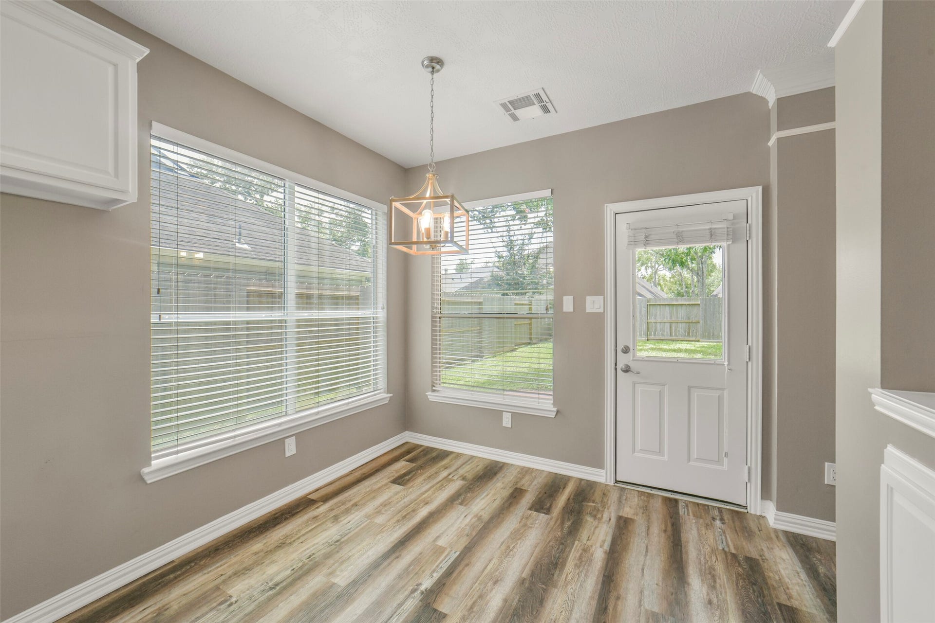 13023 Norstrum Falls Court, Cypress, TX 77429 Located right off the kitchen, the bright breakfast area offers a lovely spot for morning coffee and convenient door access directly to the outdoor space.