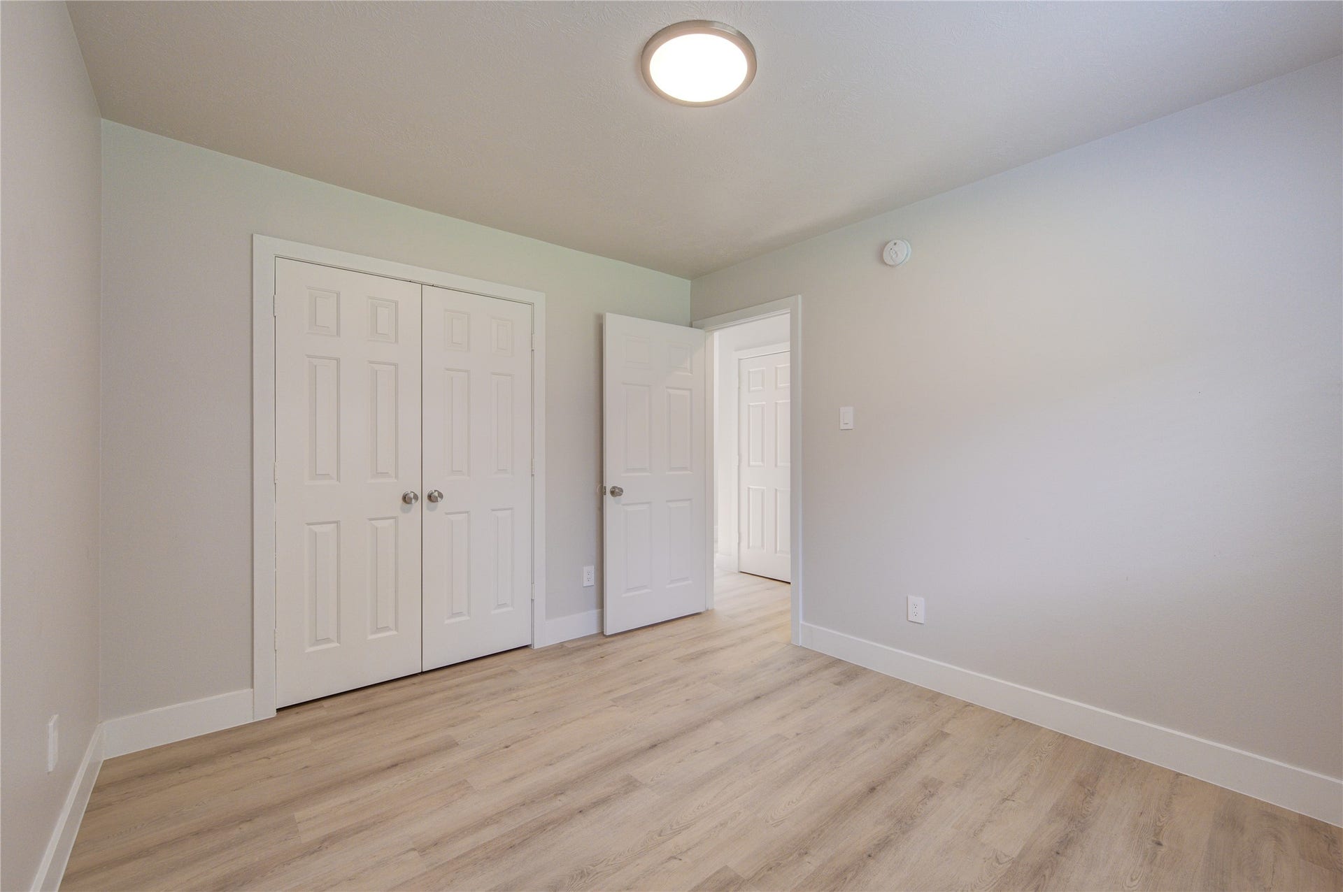 4931 Lake Catherine Court, Richmond, TX 77407 Generously sized secondary bedroom featuring fresh paint, new flooring, ample closet space and a flexible layout
