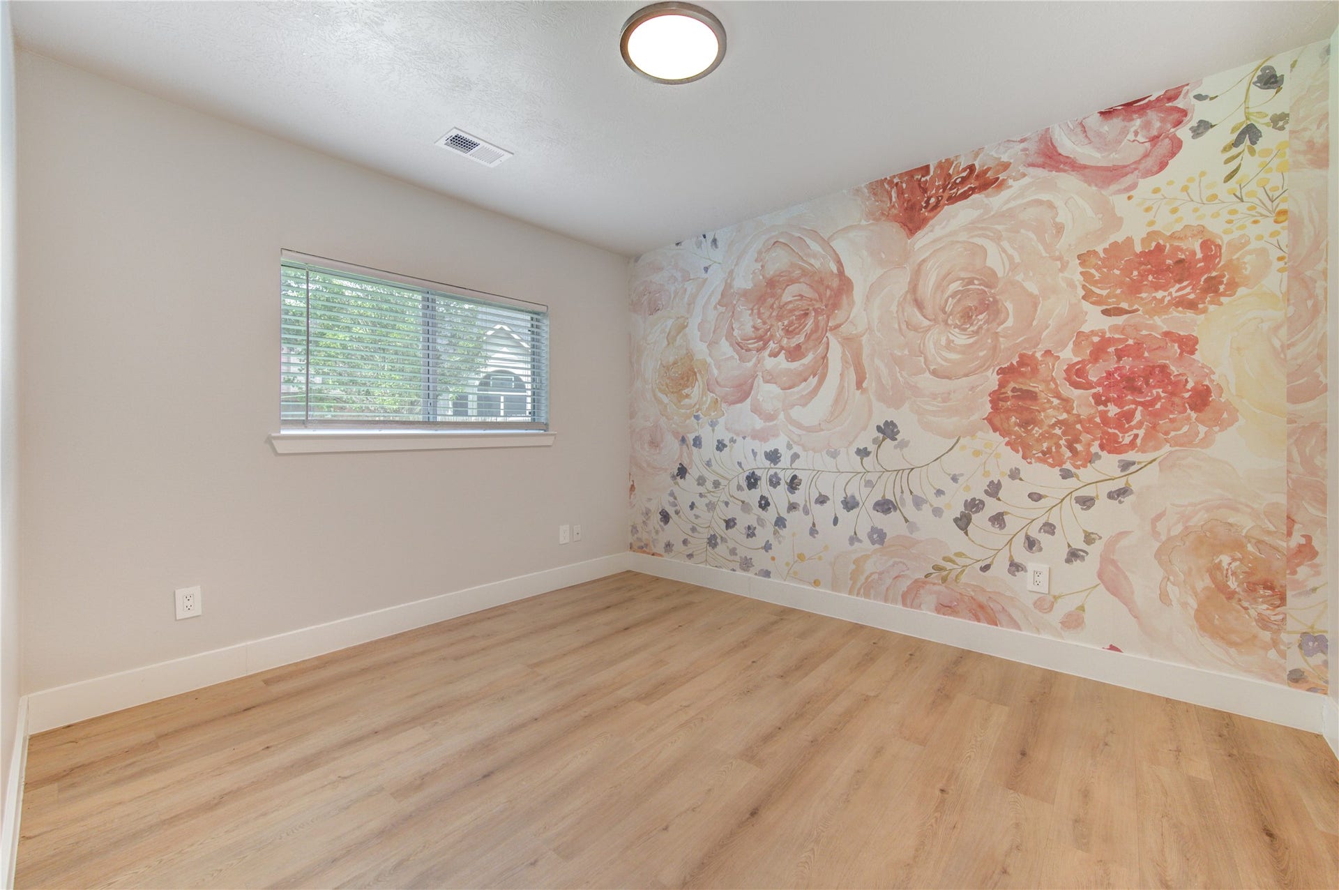 4931 Lake Catherine Court, Richmond, TX 77407 One of four spacious bedrooms, this versatile room is ideal for a guest bedroom, nursery, home office with updated luxury vinyl plank flooring and abundant natural light