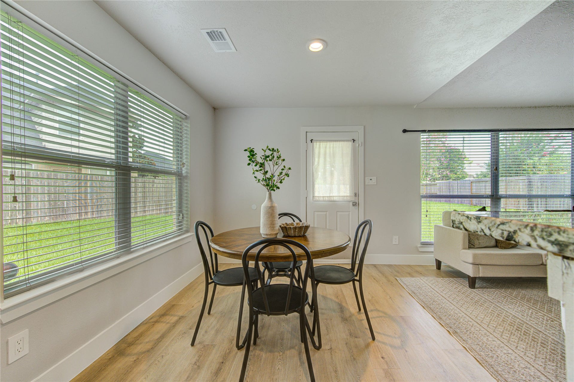 4931 Lake Catherine Court, Richmond, TX 77407 The breakfast area is surrounded by natural light and offers direct access to the covered patio, making indoor-outdoor dining simple and convenient