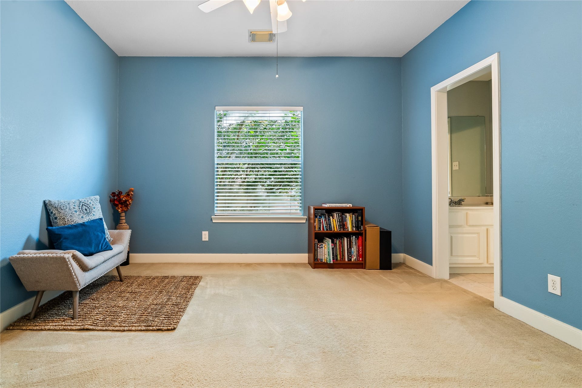 7914 Chianti Court, Sugar Land, TX 77479 Bright bedroom with soft carpeting, neutral tones, and a large window offers a comfortable and versatile space.