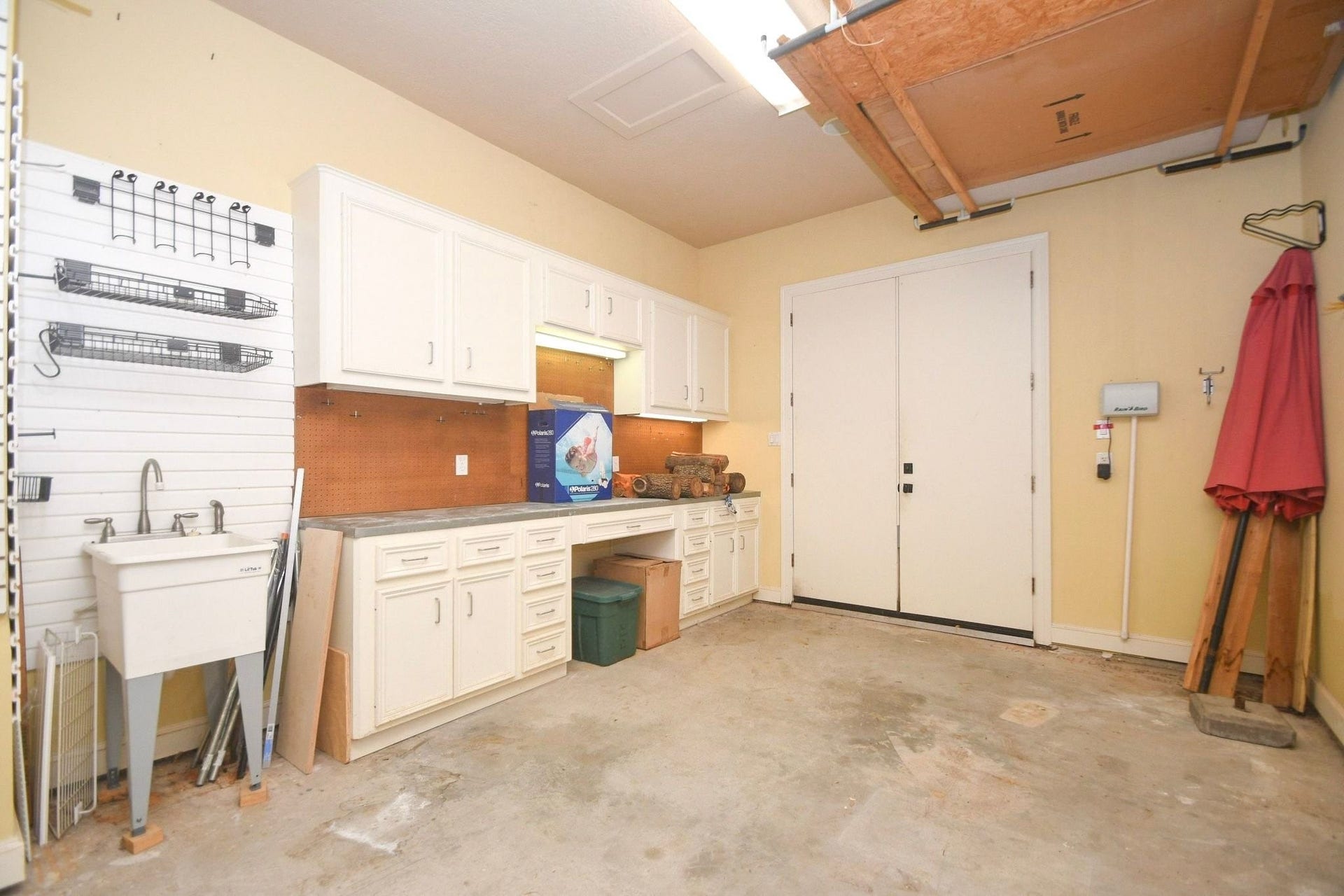 5206 Cedar Bend Creek, Houston, TX 77041 Third bay of the garage features a dedicated workbench and a utility sink!