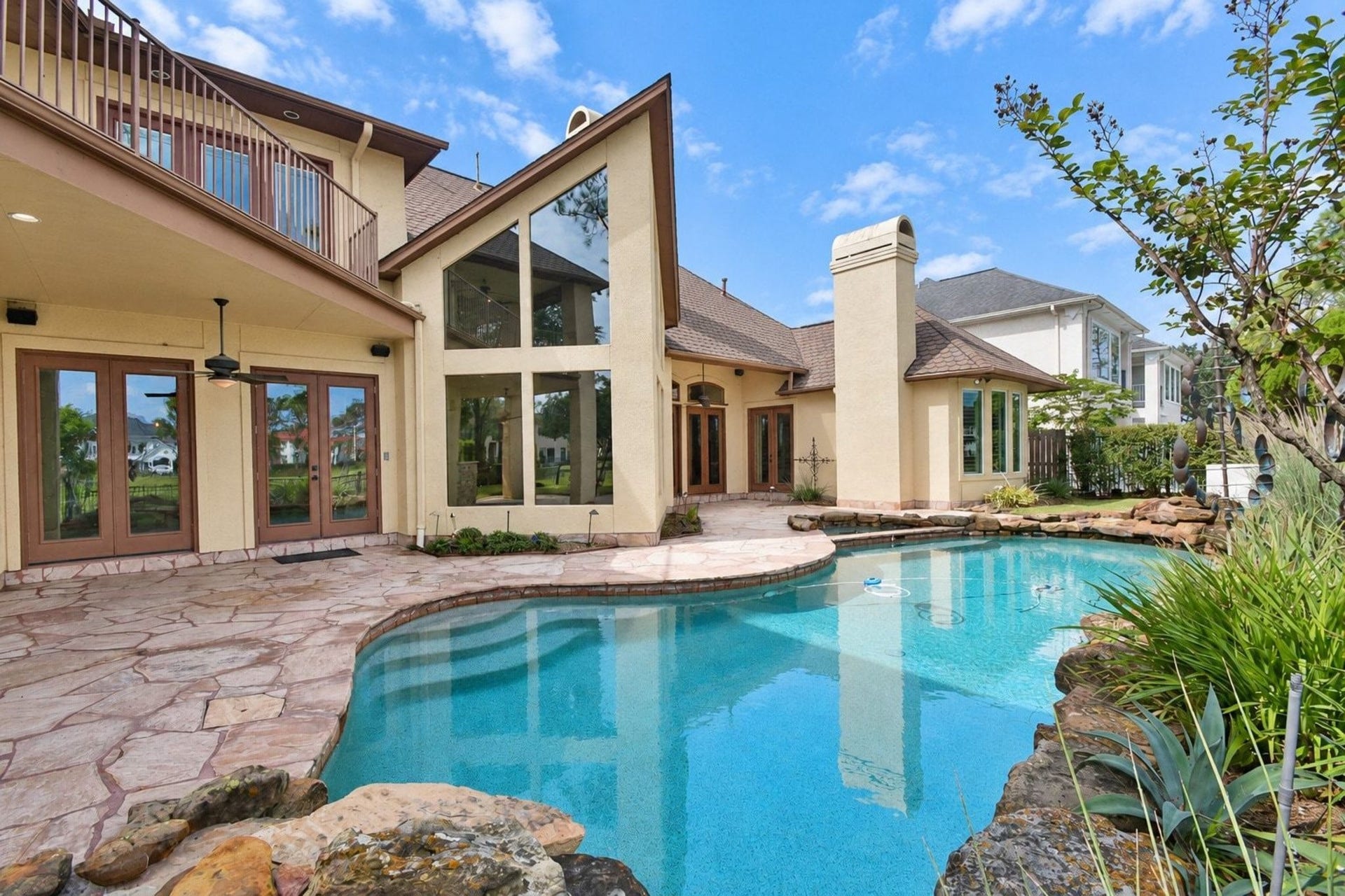 5206 Cedar Bend Creek, Houston, TX 77041 Beautiful custom pool perfect for entertaining, featuring professional landscaping, integrated lighting, and a spacious deck area designed for hosting guests!