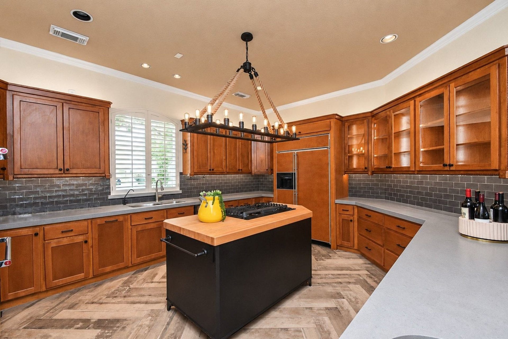 5206 Cedar Bend Creek, Houston, TX 77041 A cook's dream with custom cabinetry. This gourmet-inspired space features high-end finishes, ample storage, and meticulously crafted custom cabinetry designed for both functionality and elegance. Perfect for any culinary enthusiast, the kitchen provides a seamless blend of style and efficiency to elevate your cooking experience!