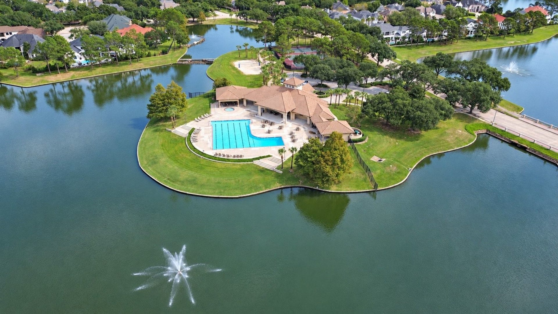 5206 Cedar Bend Creek, Houston, TX 77041 Aerial view of the community pool and recreation center, showcasing the resort-style amenities and expansive lounge areas available to residents!