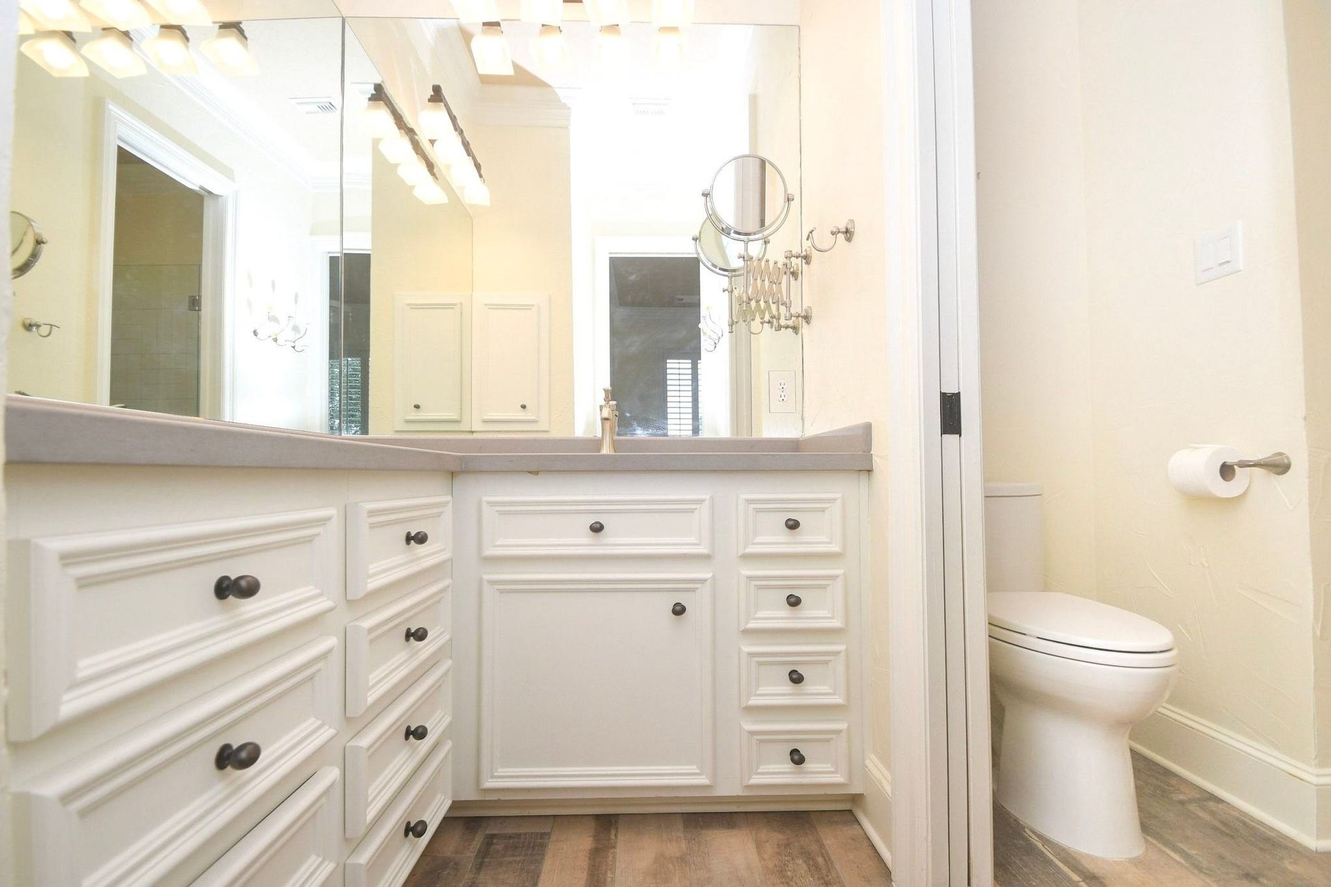 5206 Cedar Bend Creek, Houston, TX 77041 This upstairs bathroom has been beautifully upgraded to feature elegant, high-end custom cabinetry that provides ample storage space, perfectly complemented by sleek, modern fixtures and contemporary hardware that add a touch of sophisticated style to the overall design of the room!