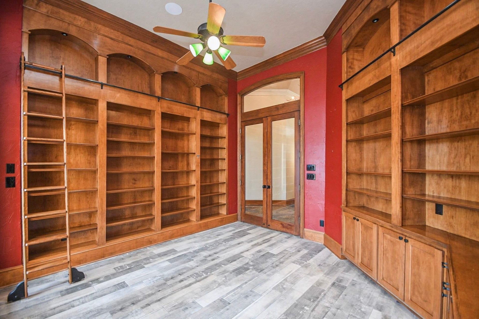 5206 Cedar Bend Creek, Houston, TX 77041 Capture the intricate craftsmanship of the study library with this alternate angle, highlighting the high-end custom cabinetry, extensive built-in shelving, and the sophisticated architectural details that make this professional workspace a standout feature of the home!