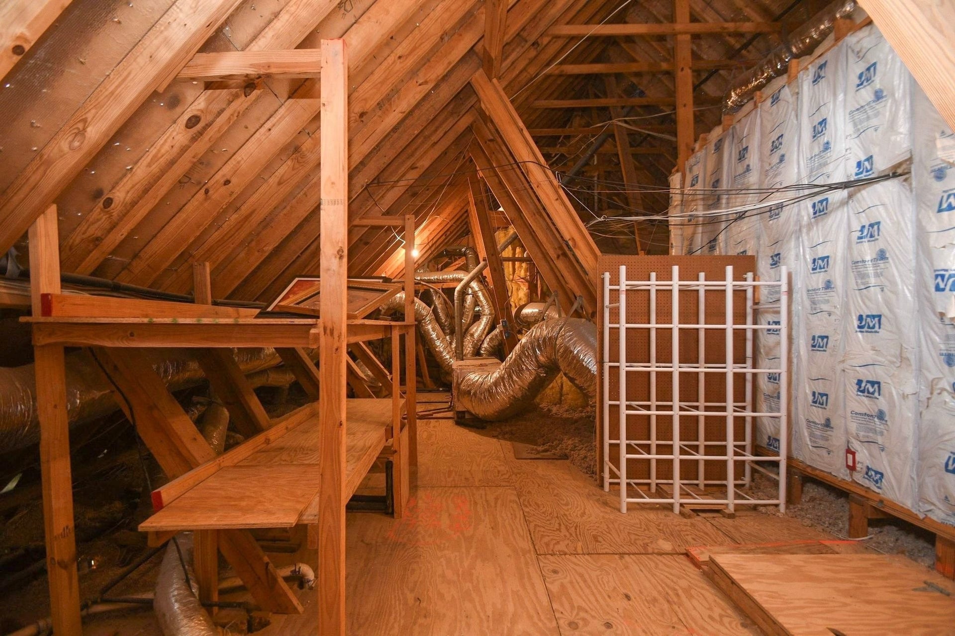 5206 Cedar Bend Creek, Houston, TX 77041 Spacious attic area featuring extensive decking, providing ample and convenient storage solutions throughout the upper level.