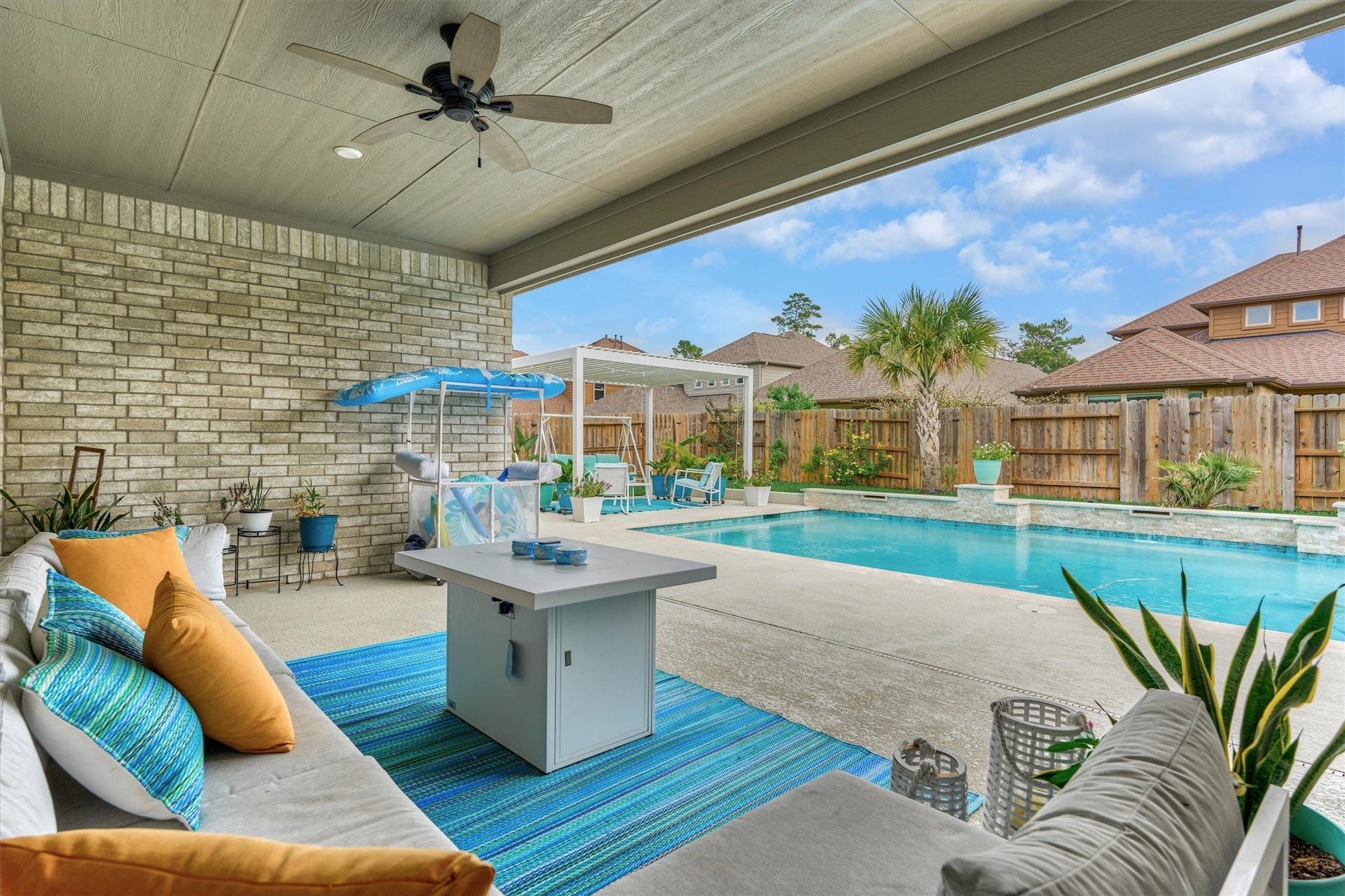 The covered patio is ready for your outdoor kitchen with water and gas connections.