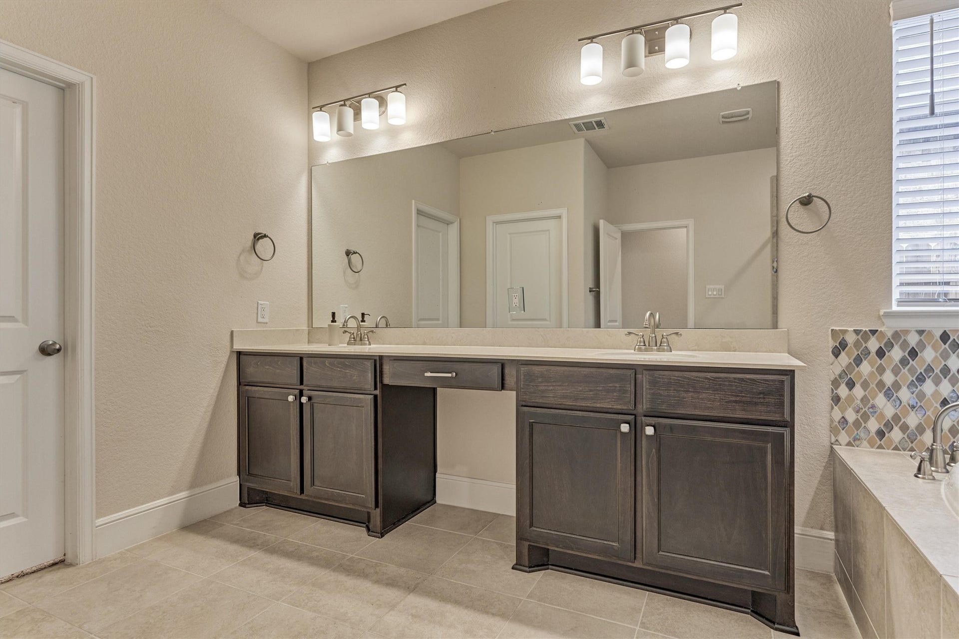 Double sinks and a vanity area.