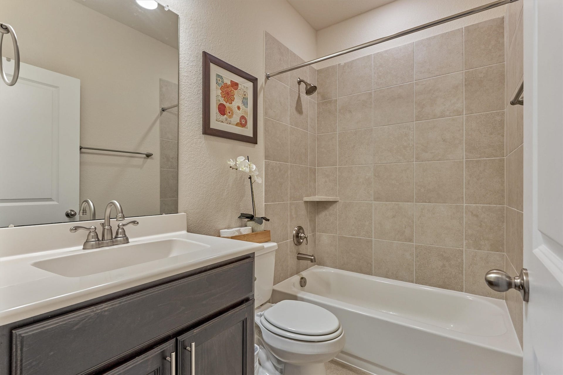 The full bathroom next to the secondary bedroom on the first floor.