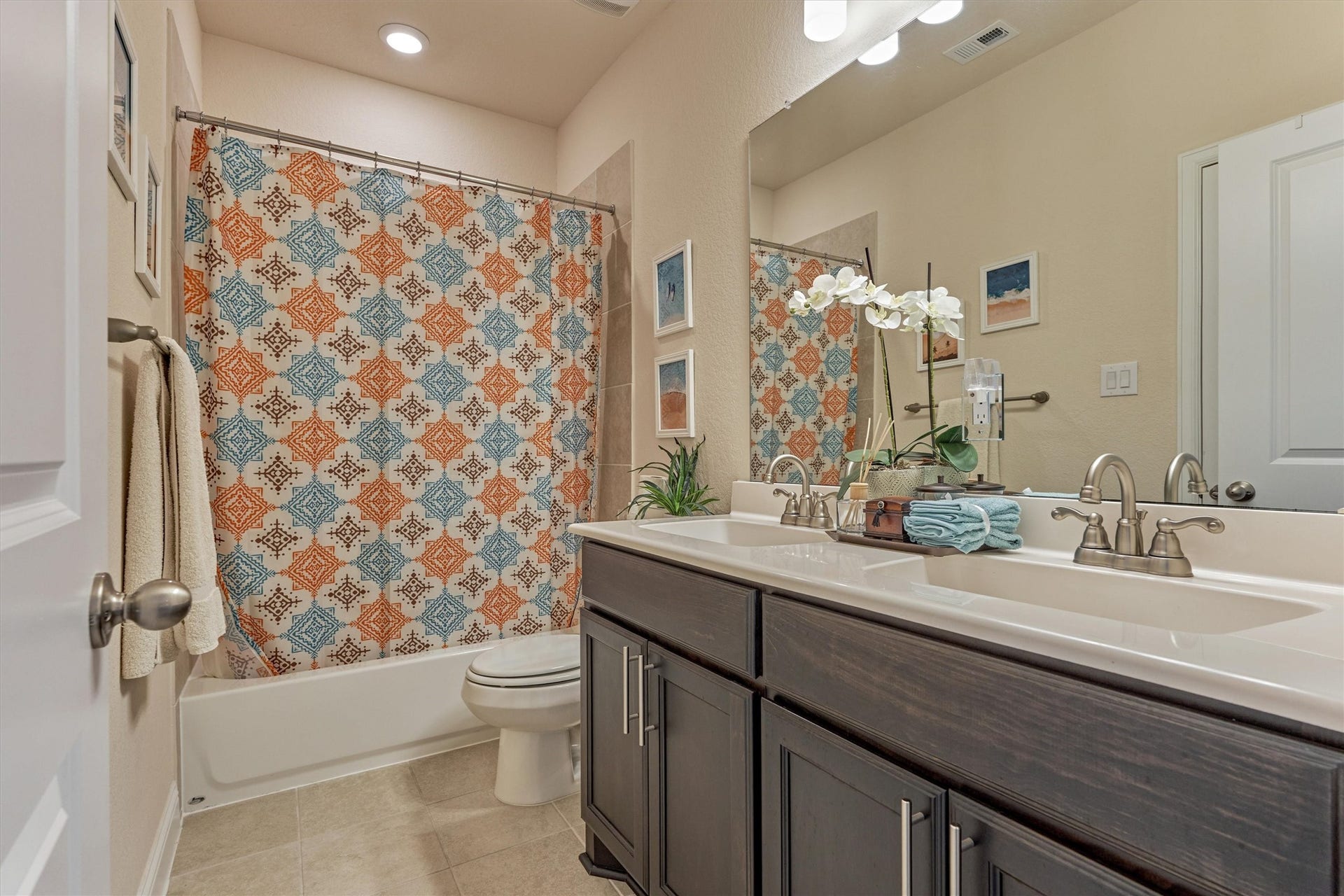 The bathroom connected to the second of the three secondary bedrooms upstairs.
